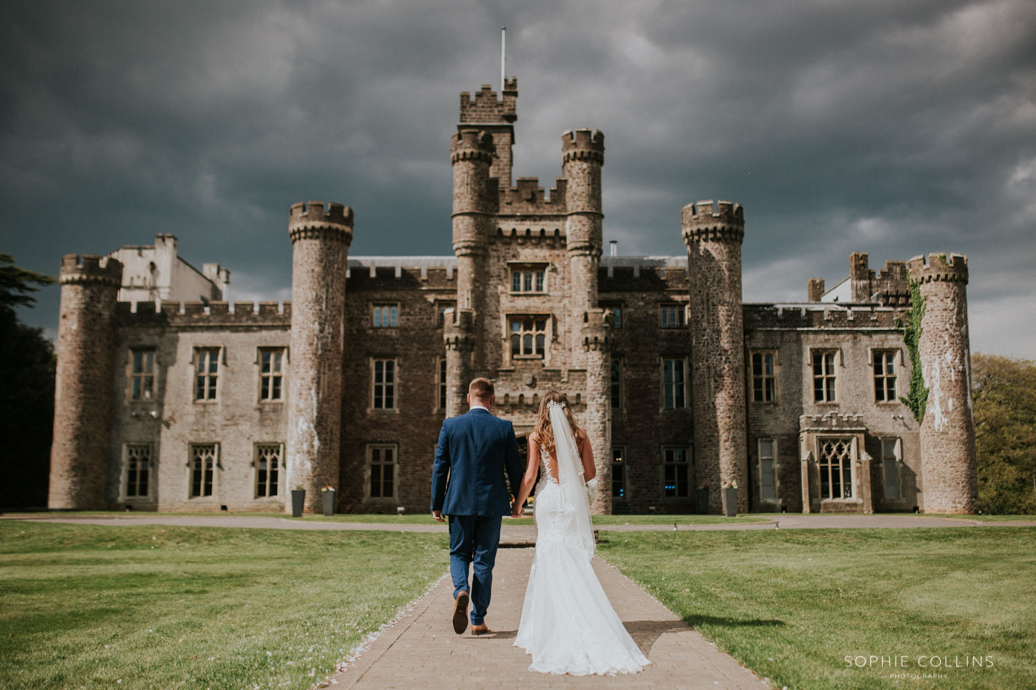 bride and groom outside the castle 