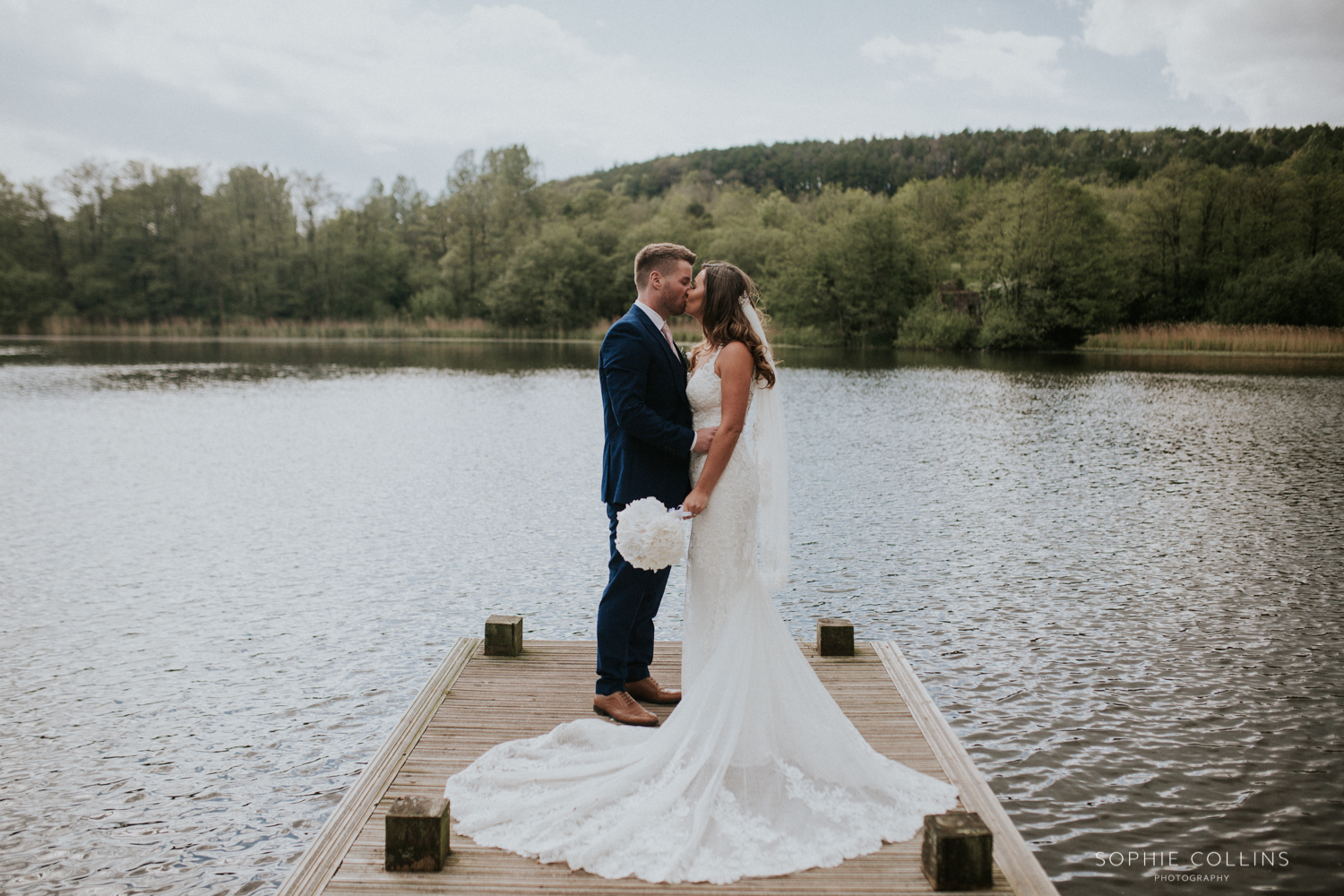 bride and groom at the lake 