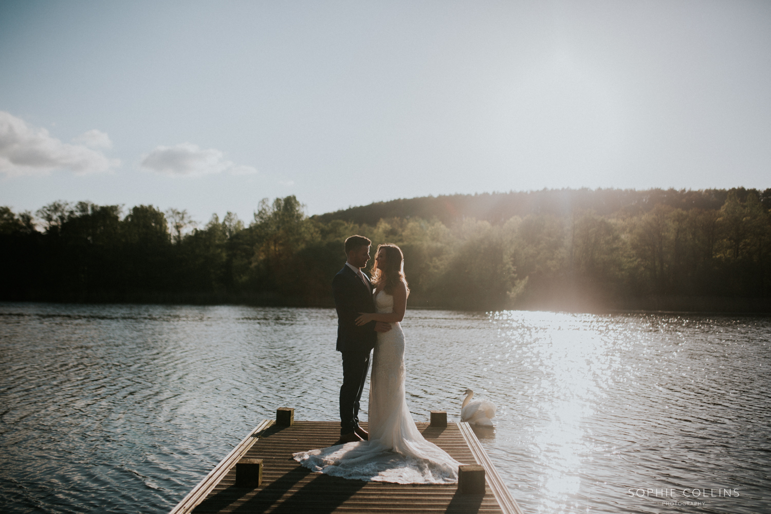 bride and groom by the lake 