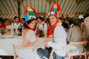 bride and groom wearing funny hats