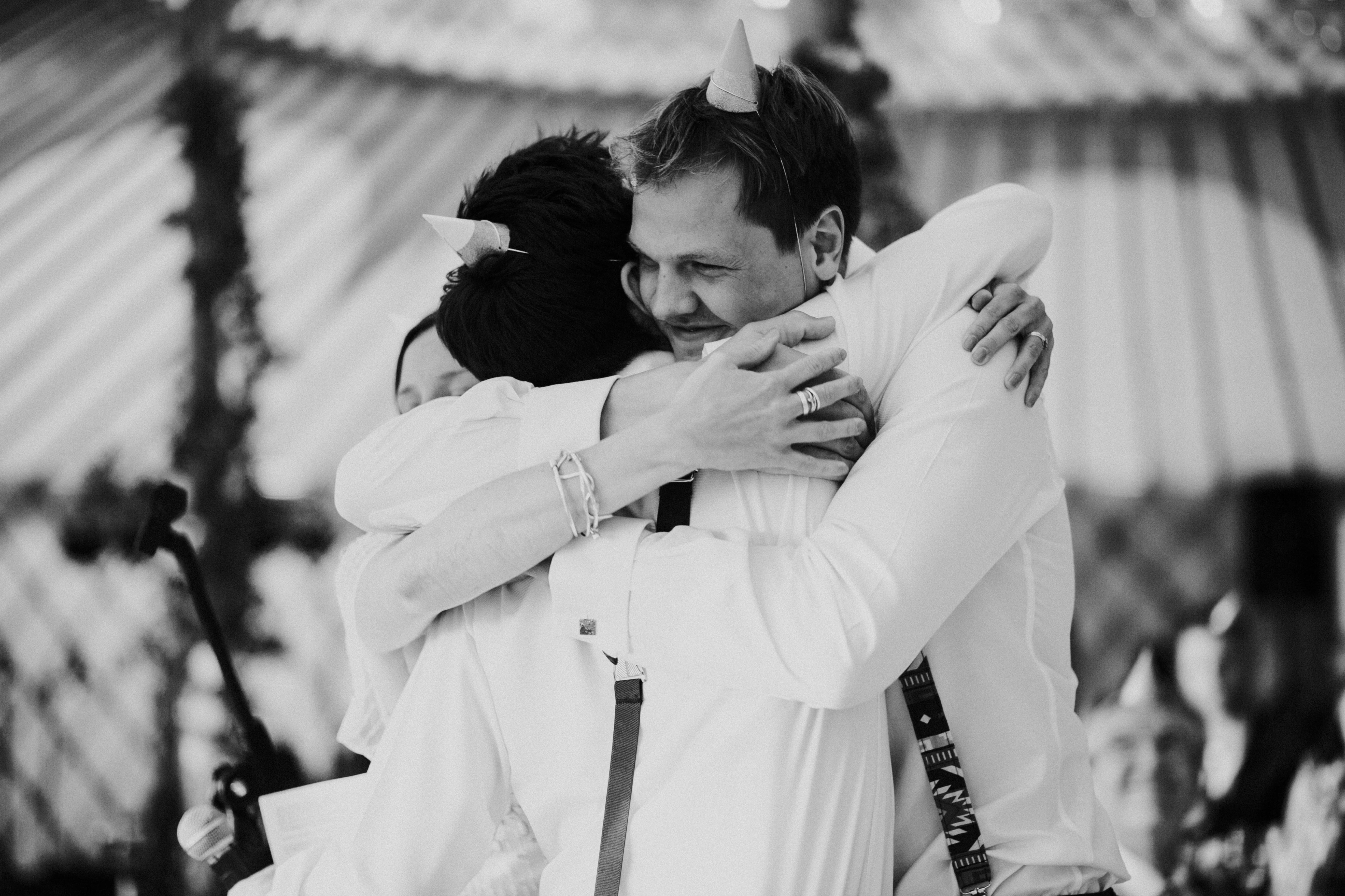 bride and groom hugging 