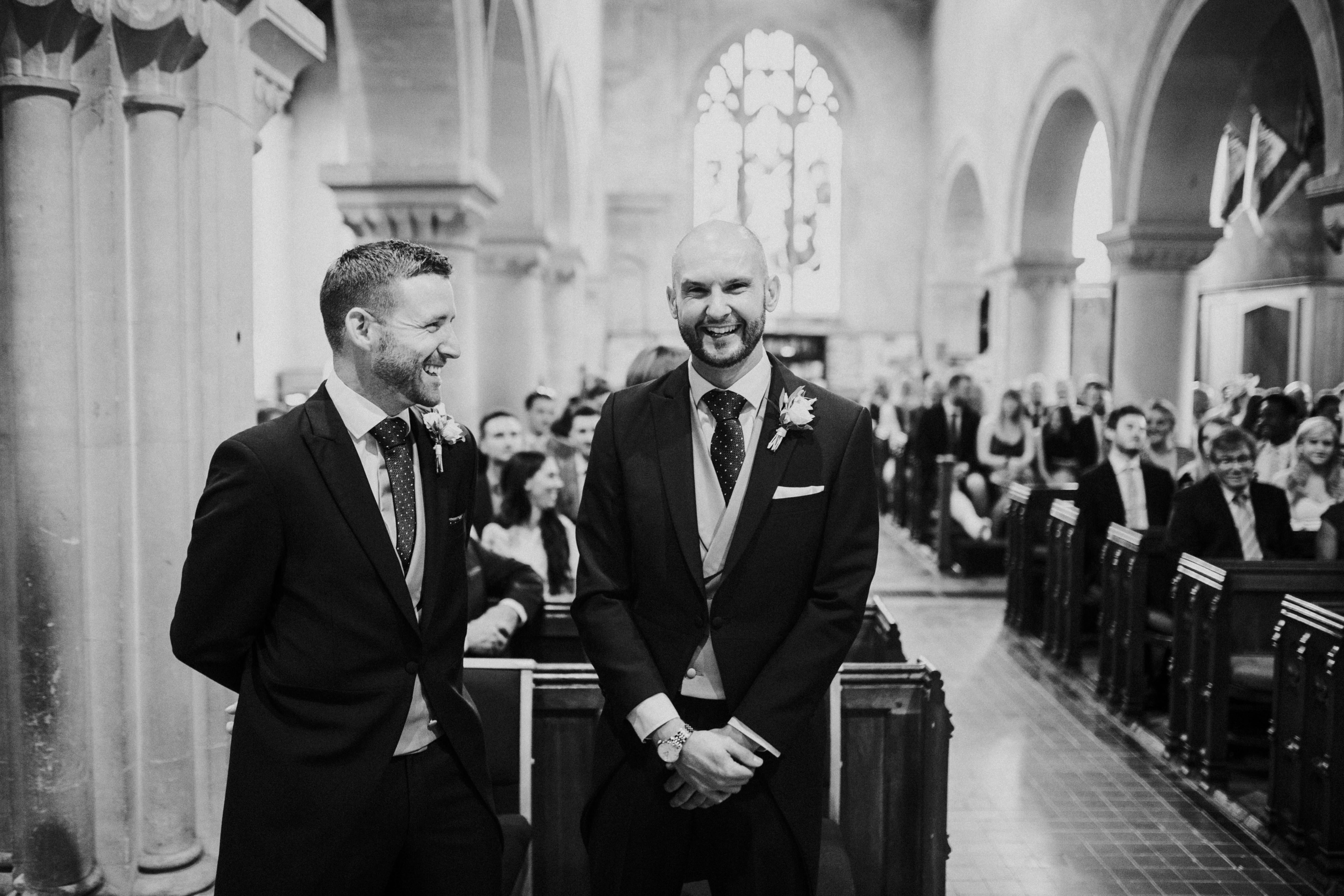 groom at top of the aisle 