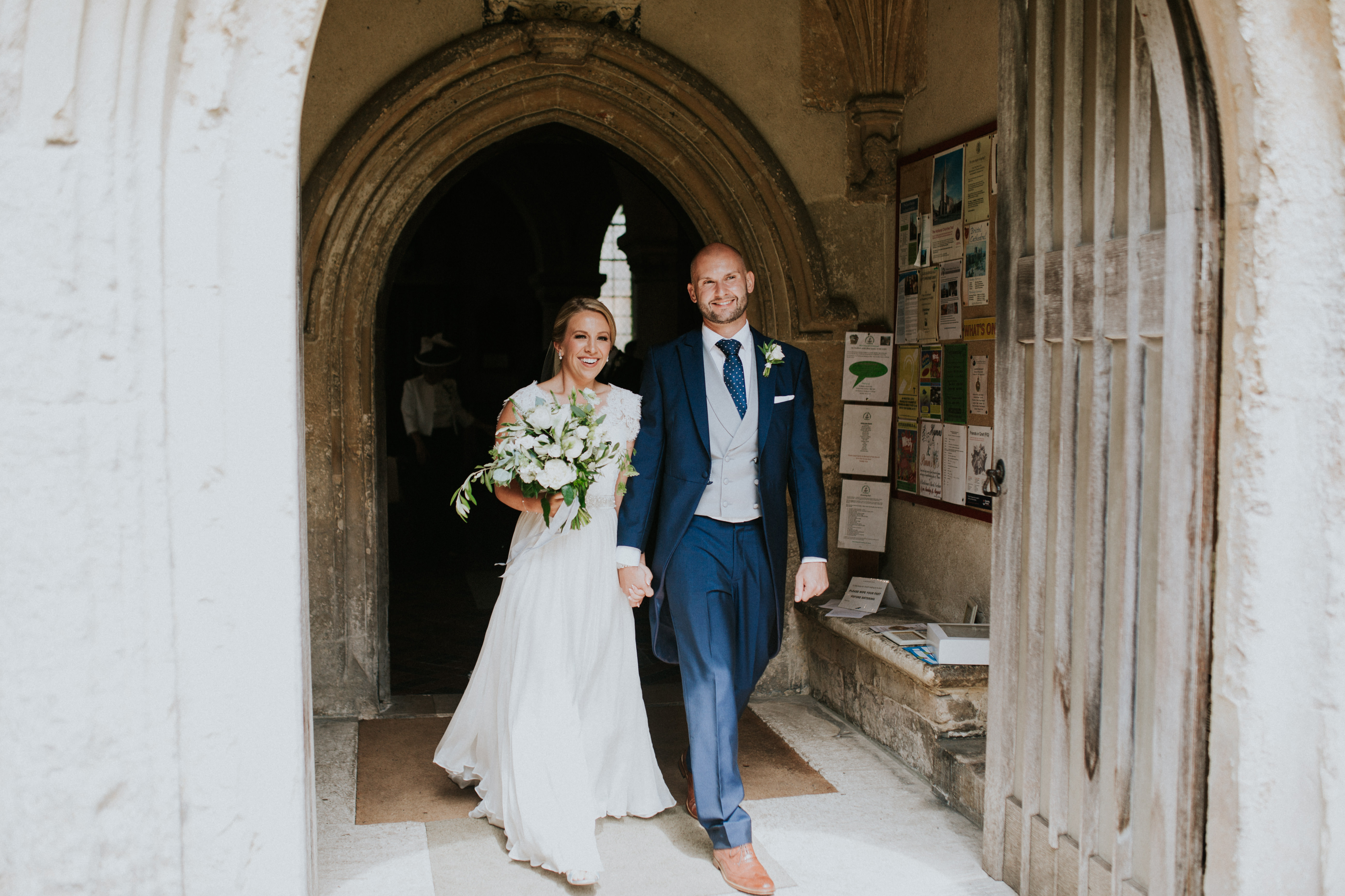 bride and groom leaving the church 