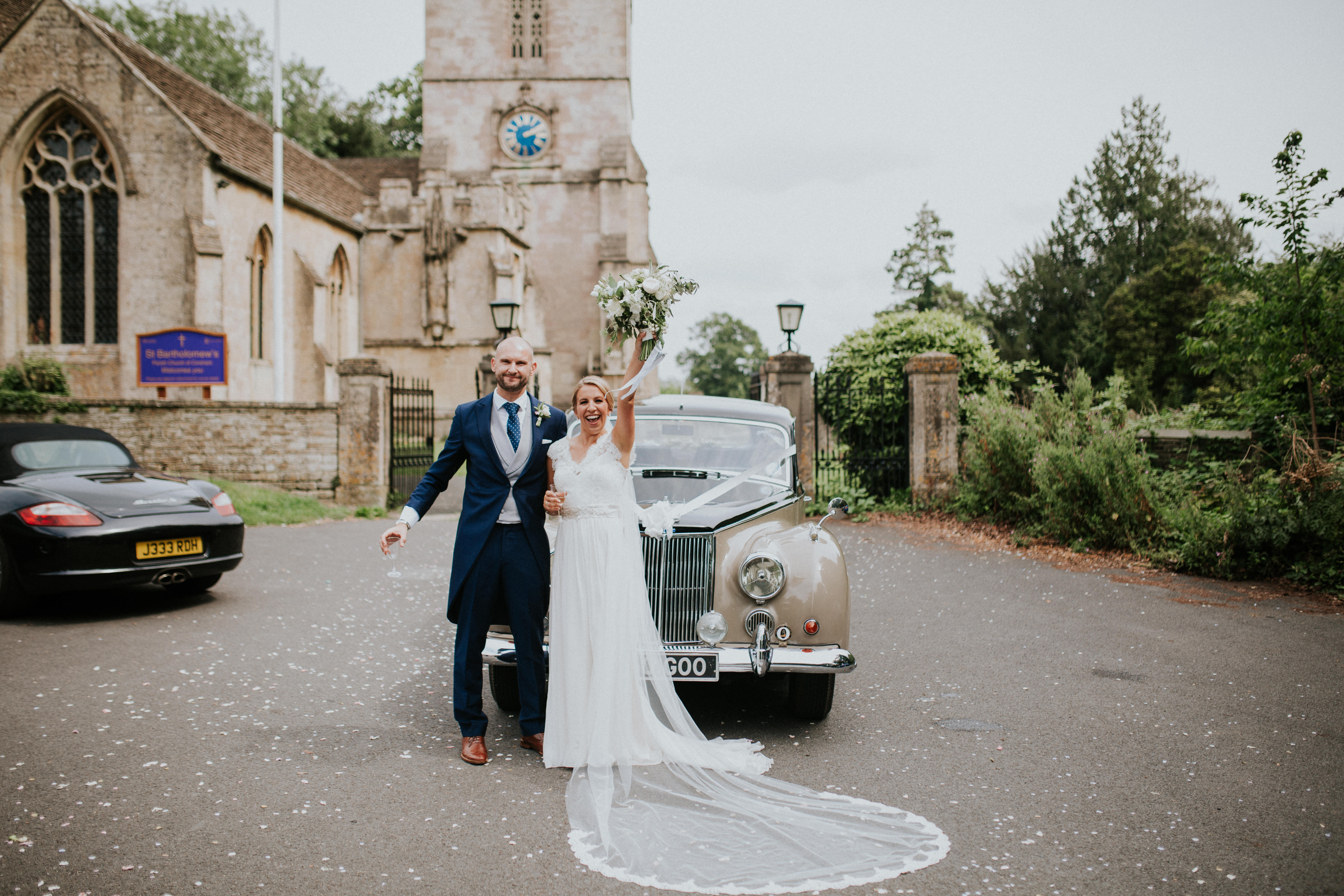 bride and groom portrait with the car 