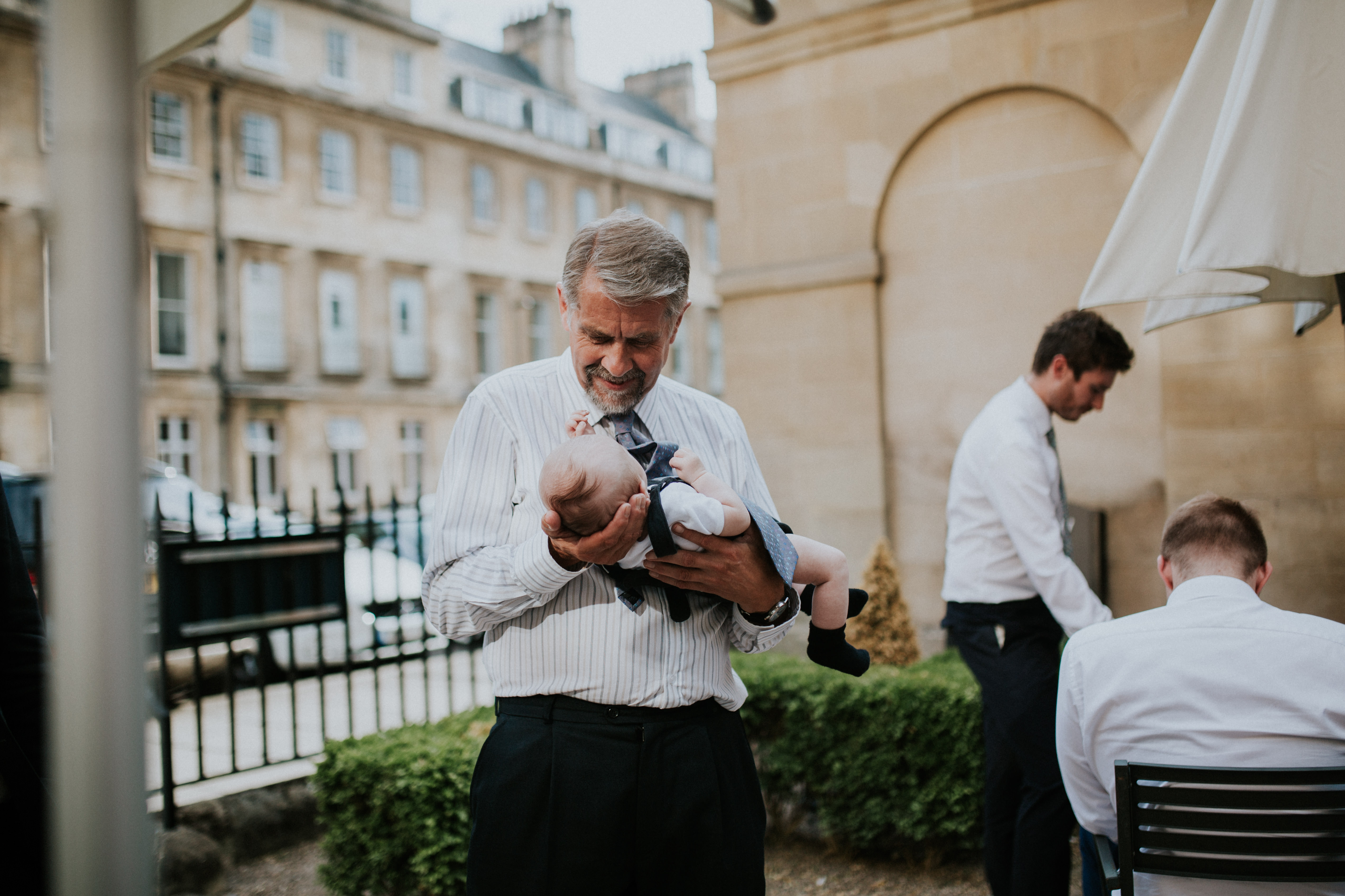 man holding baby 