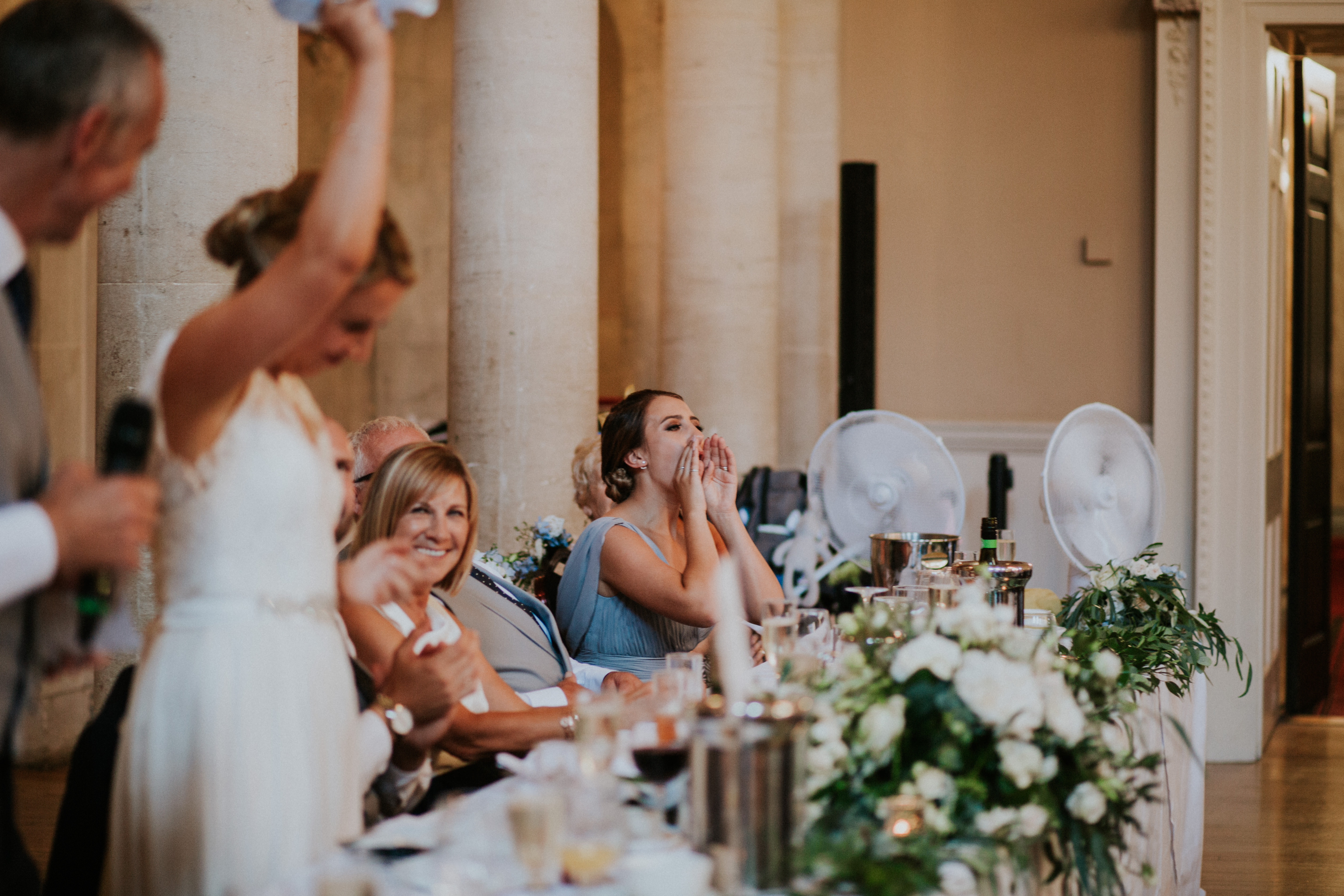 sister of the bride laughing 