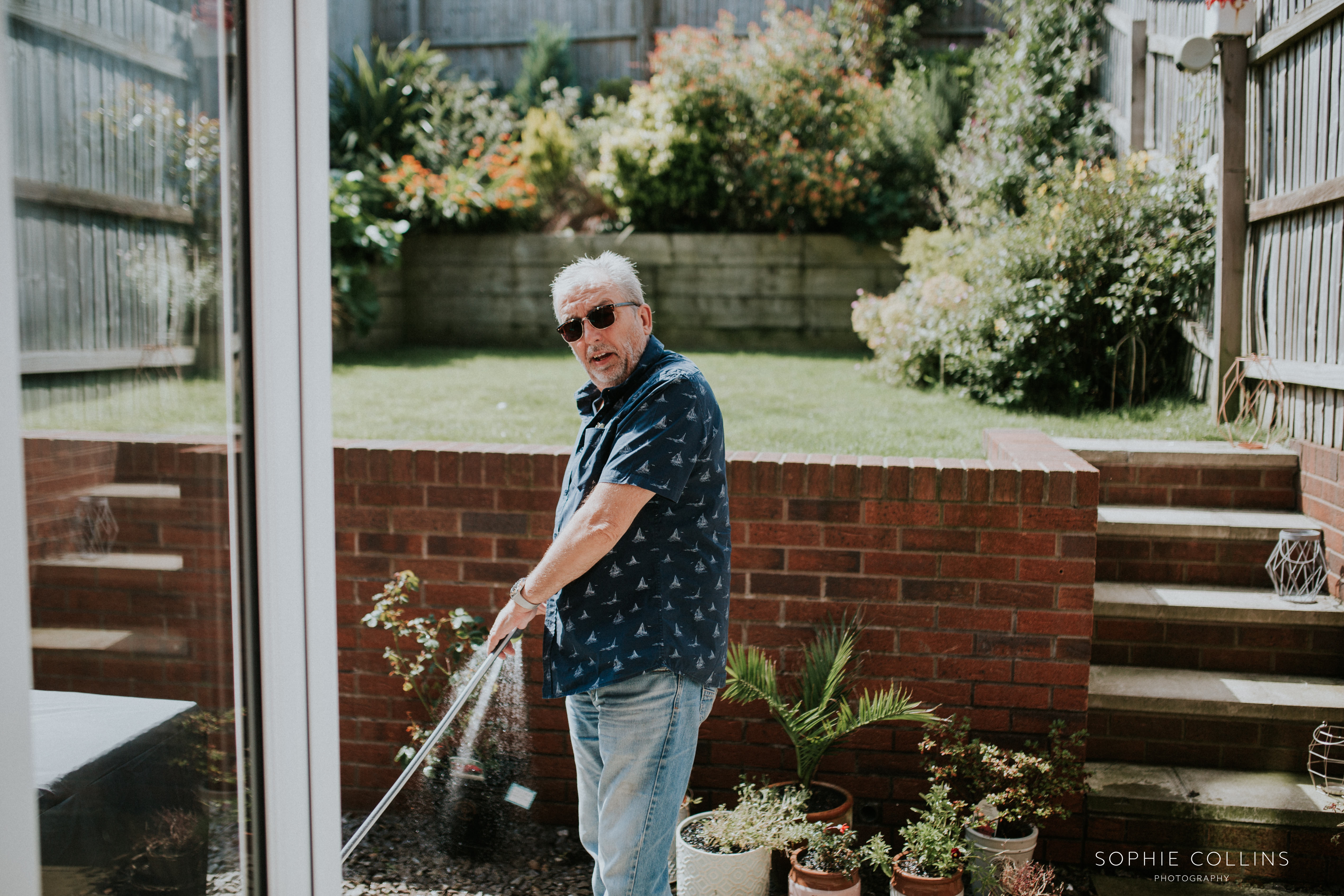 dad watering flowers 