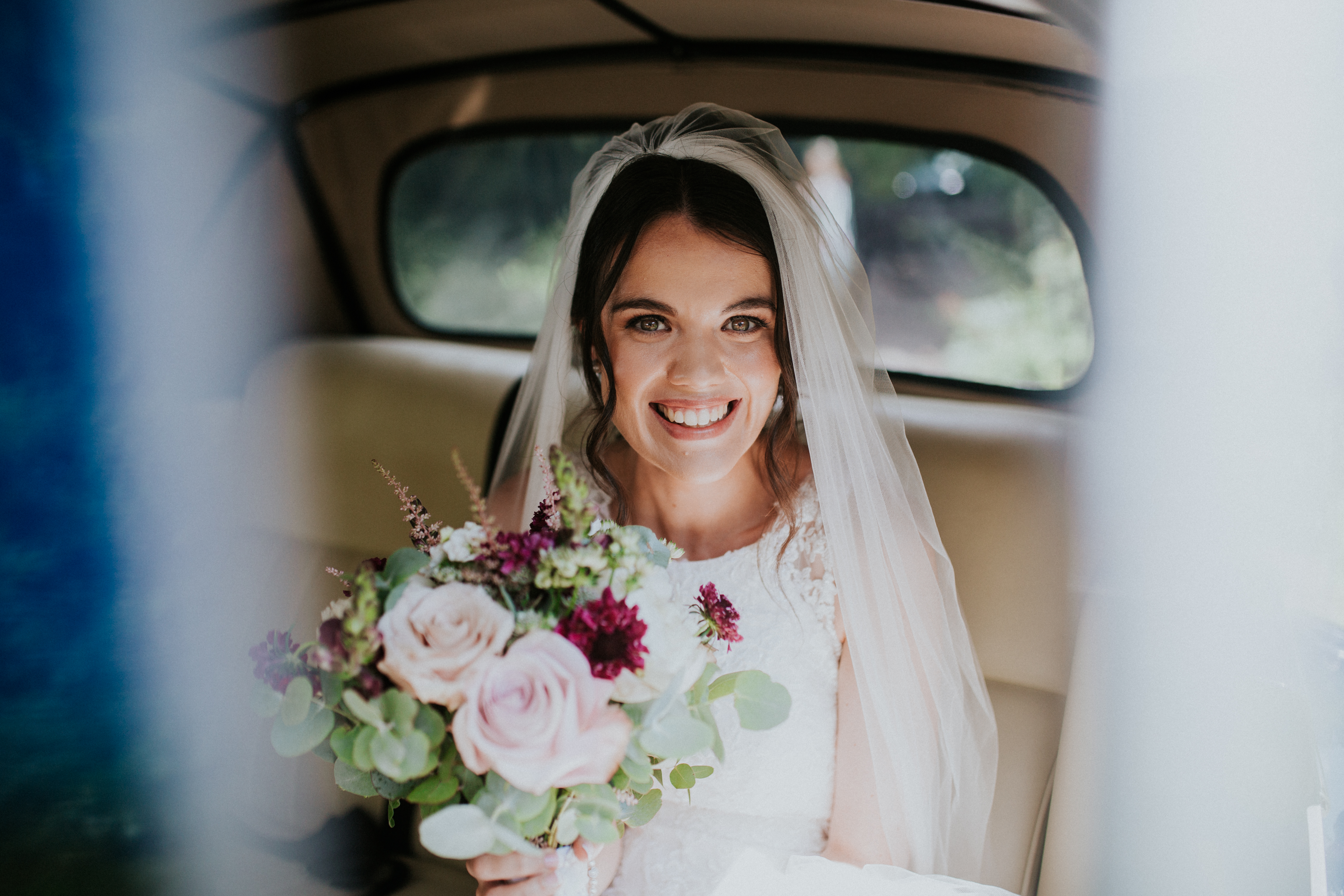 bride in the wedding car 