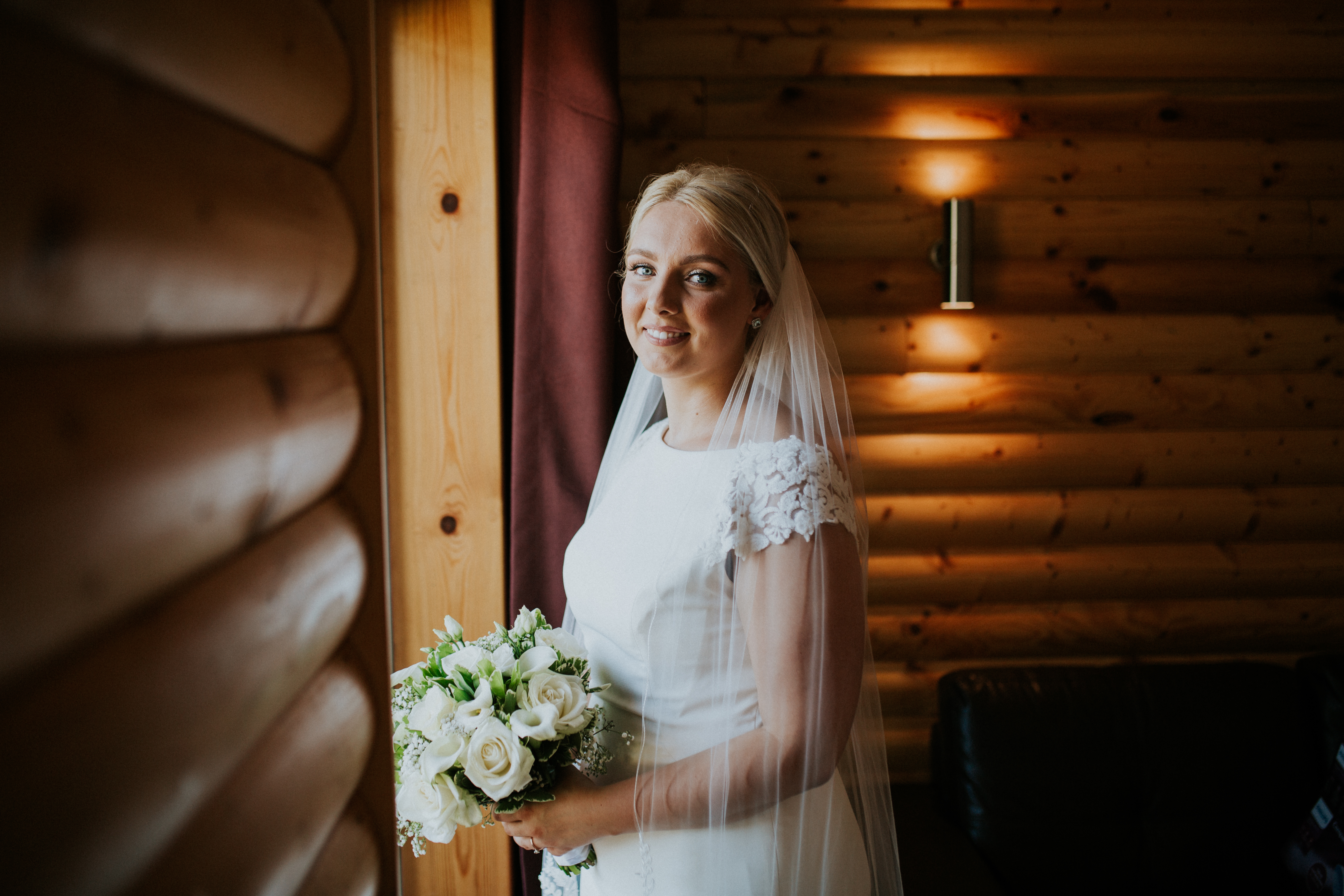 bride stood by the window