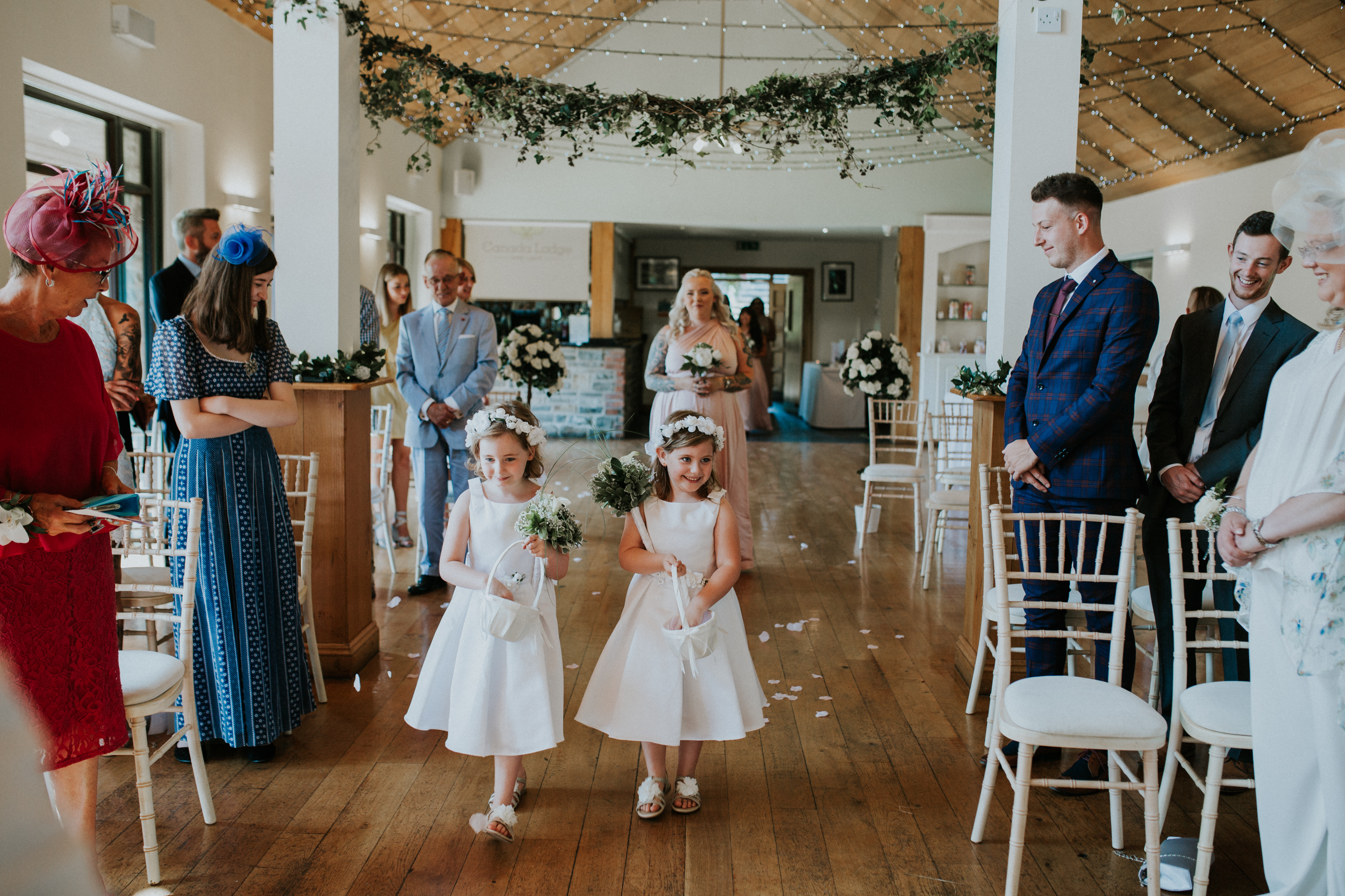 flower girls walking down the aisle