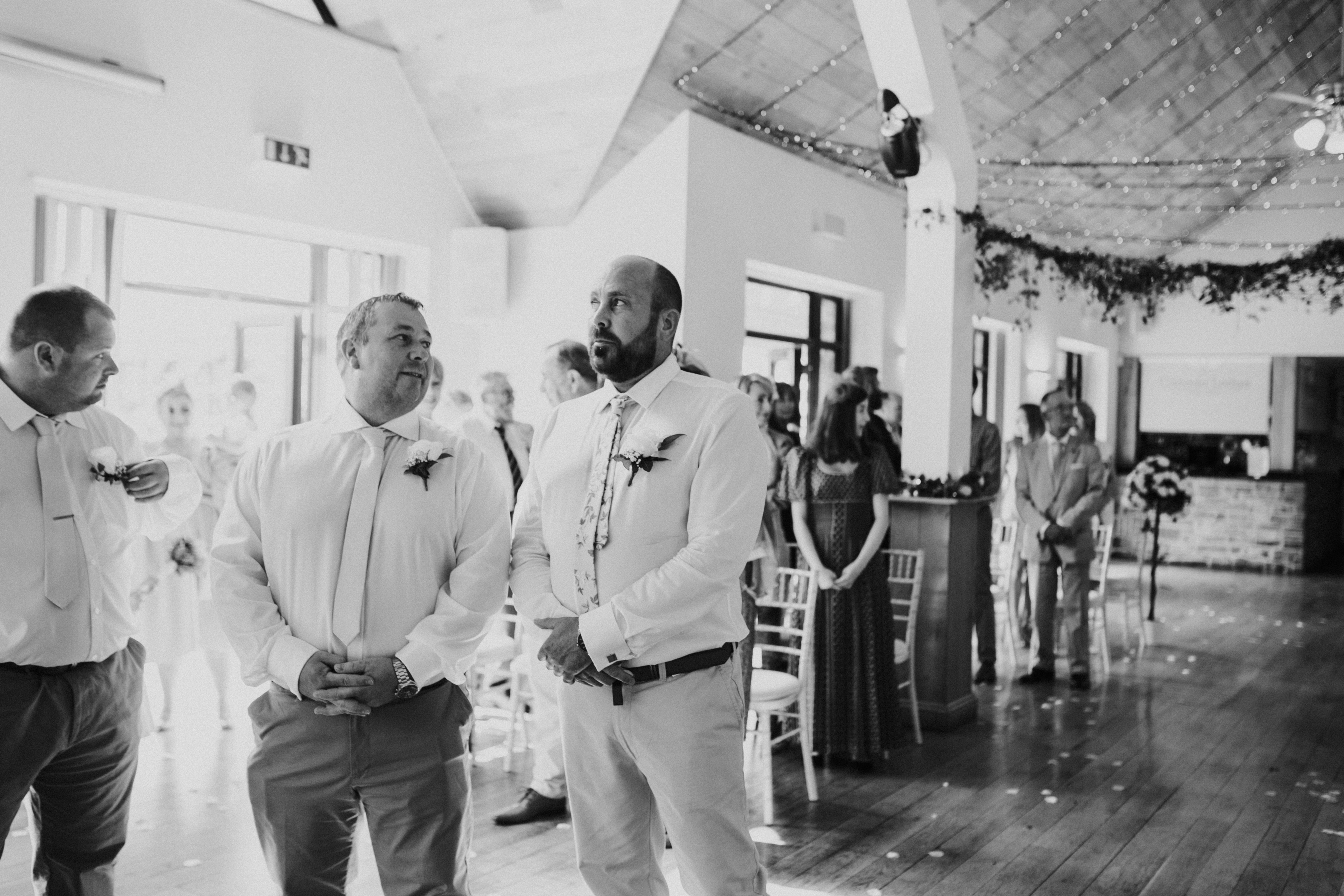 groom waiting at the aisle