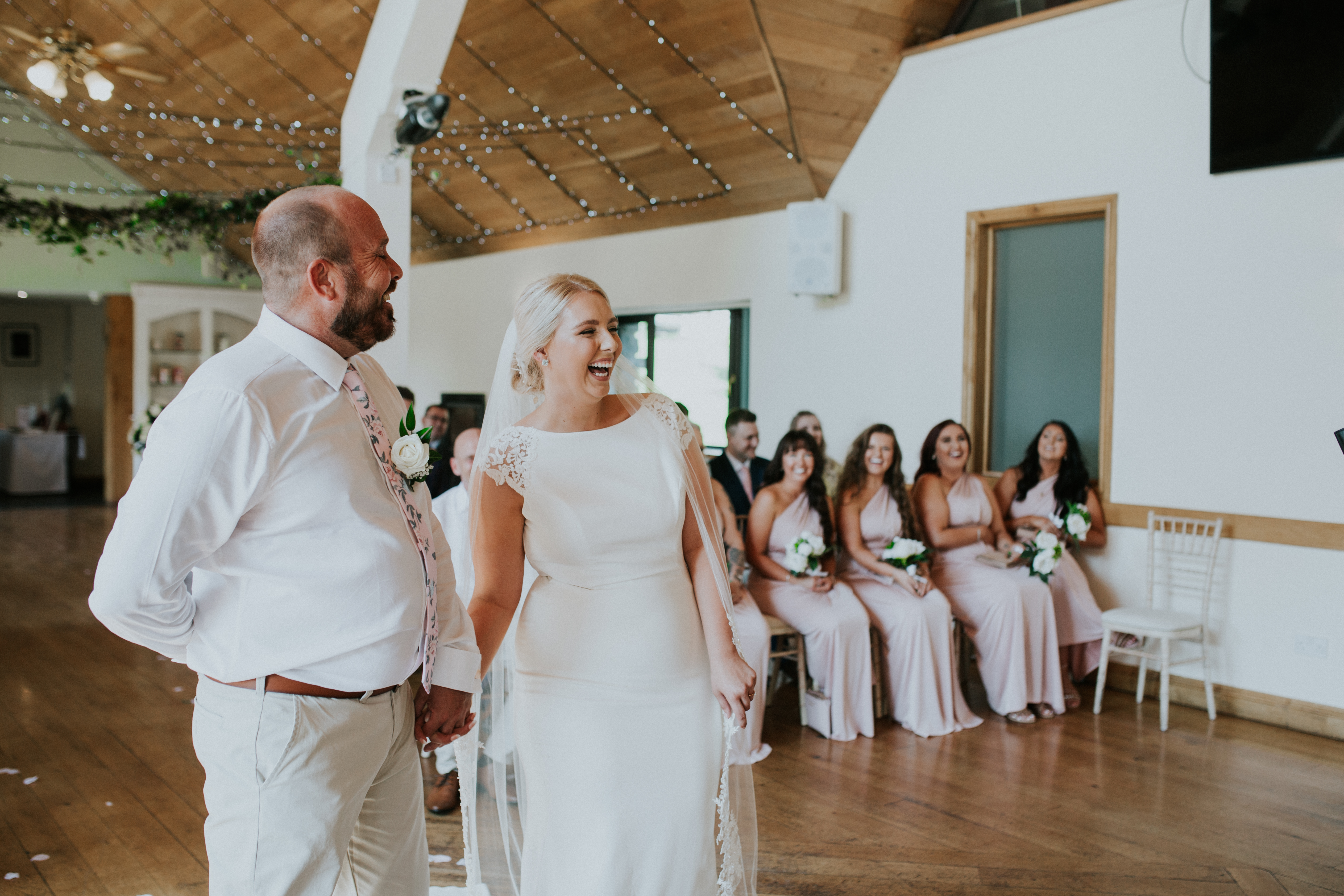 bride and groom laughing