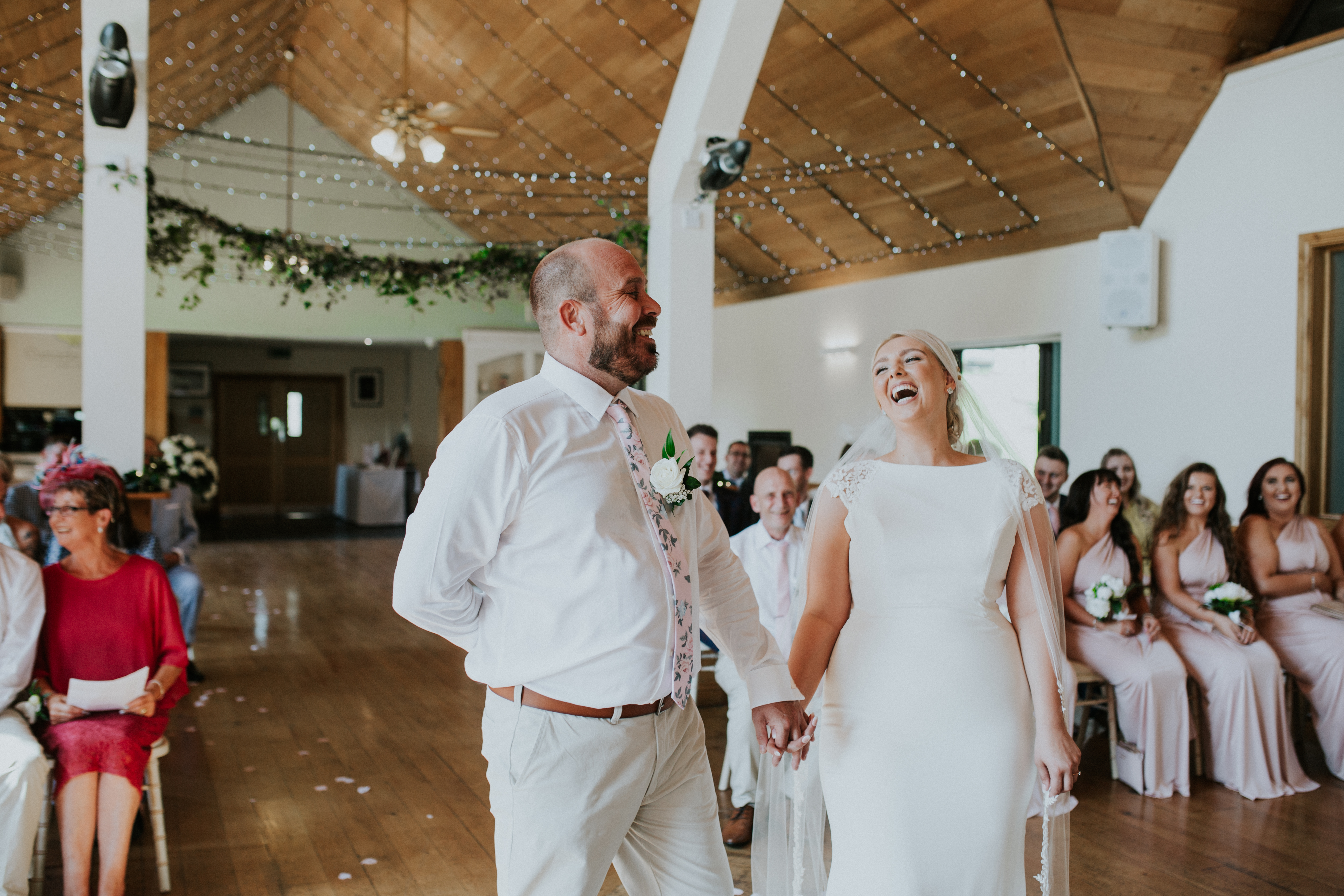 bride and groom laughing