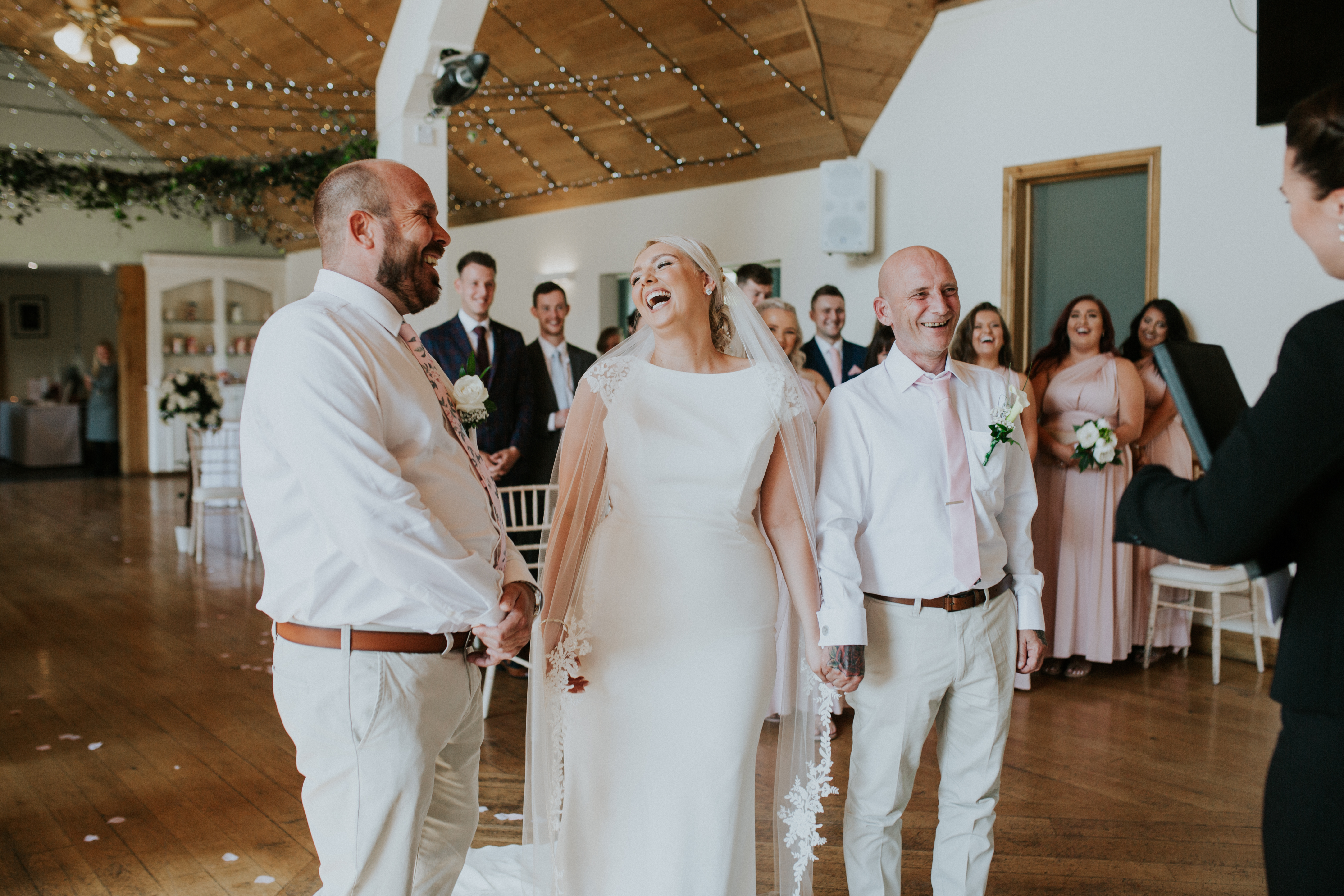 bride and groom laughing