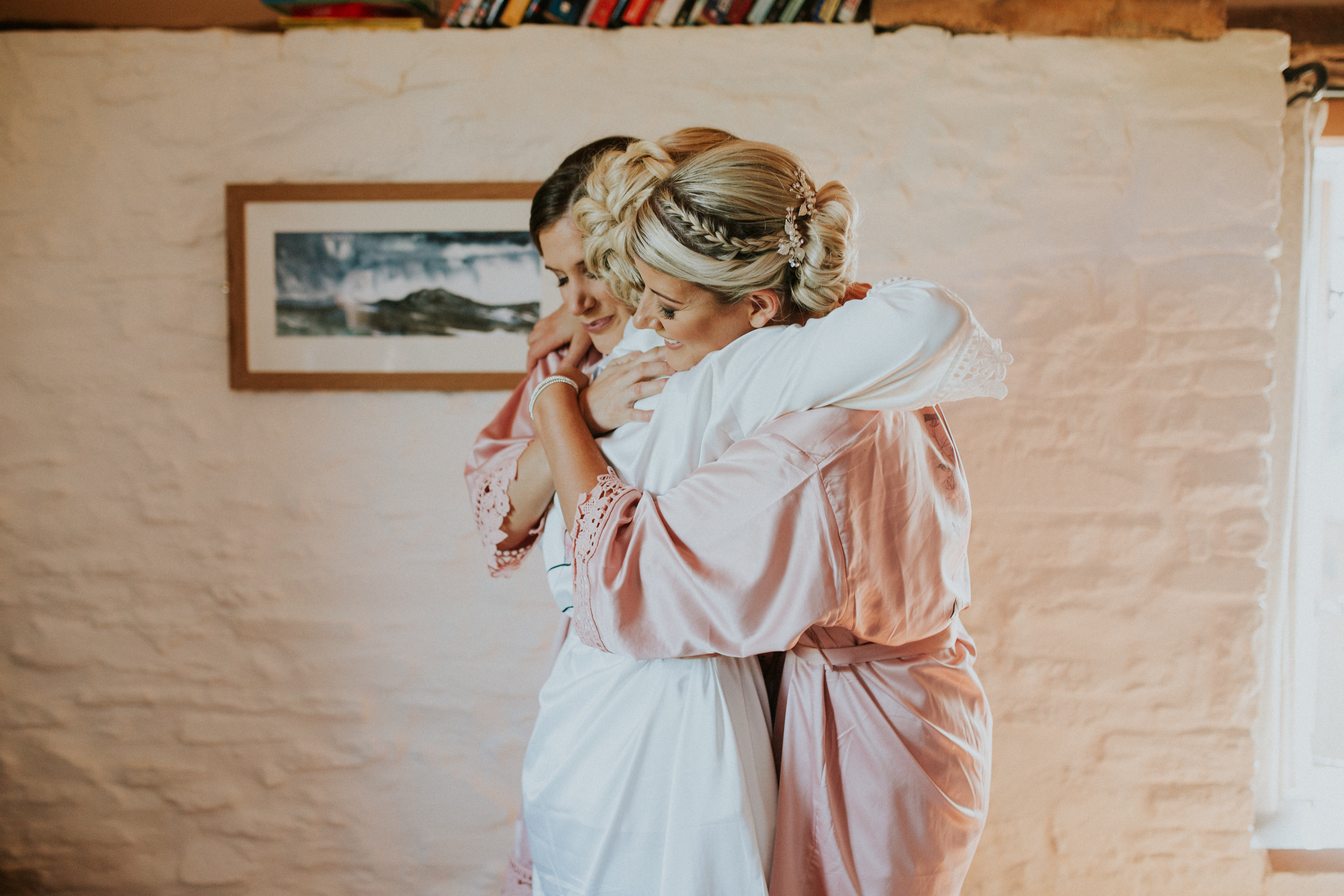 bridesmaids hugging 