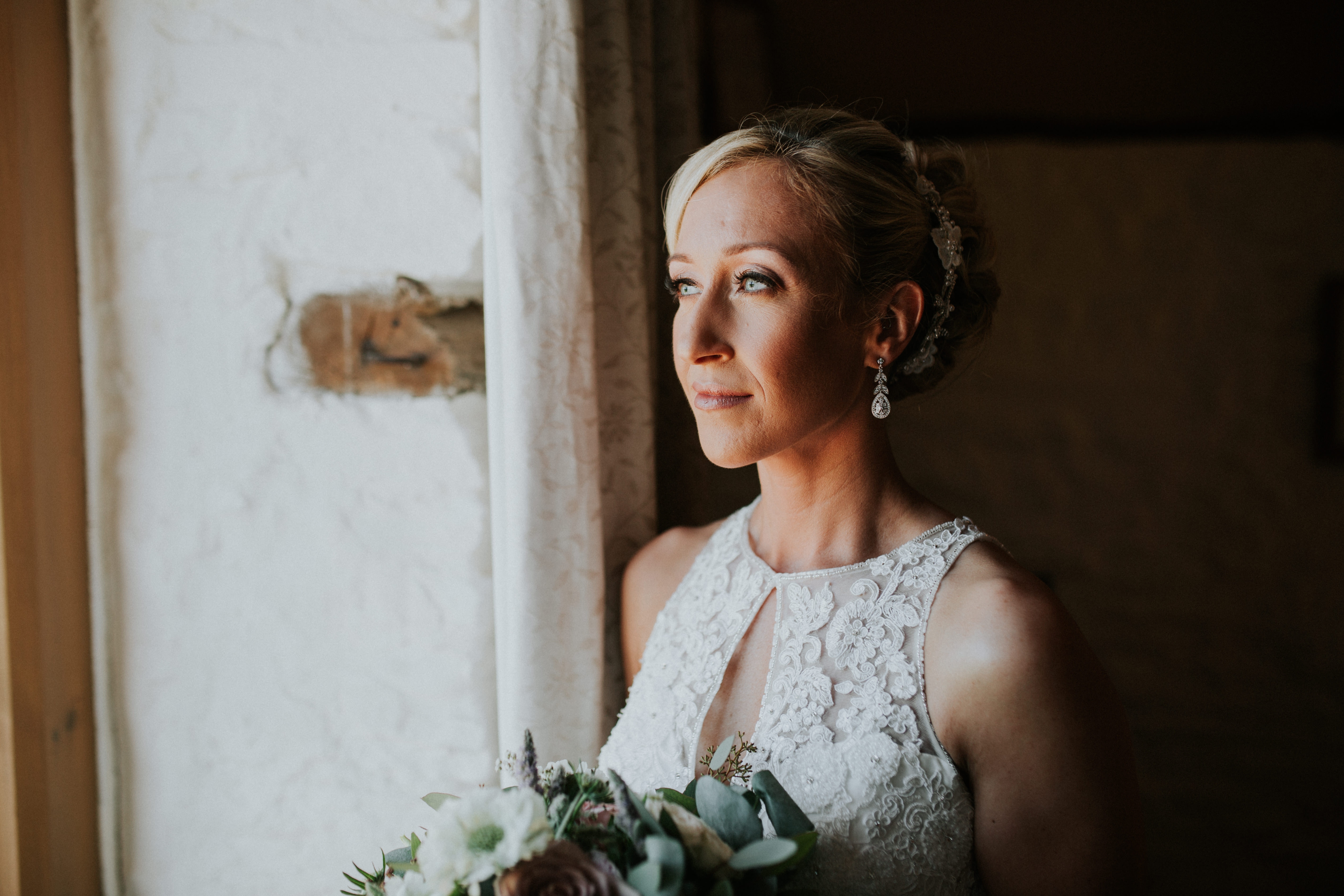 bride looking out the window 