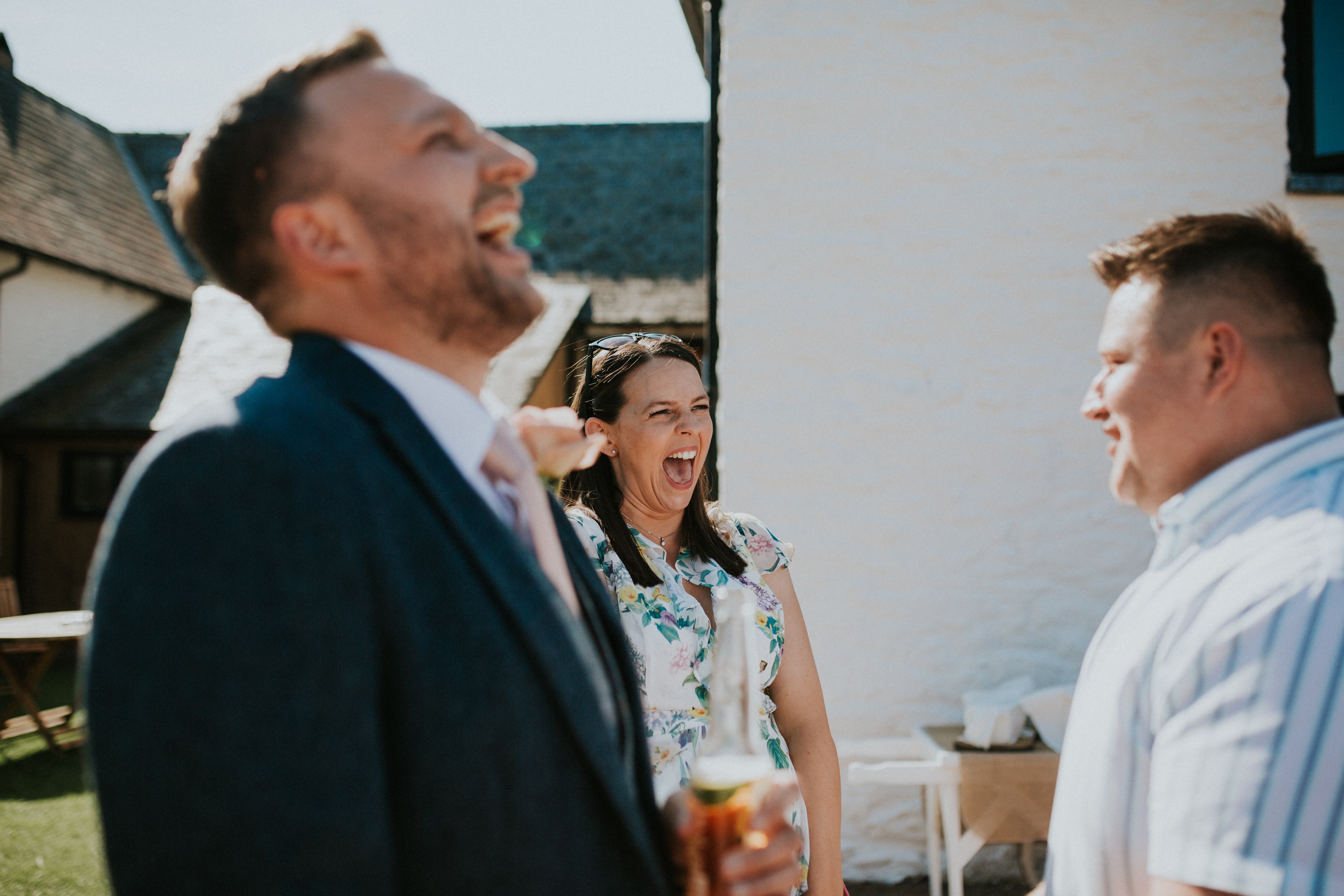 guests laughing at magician 