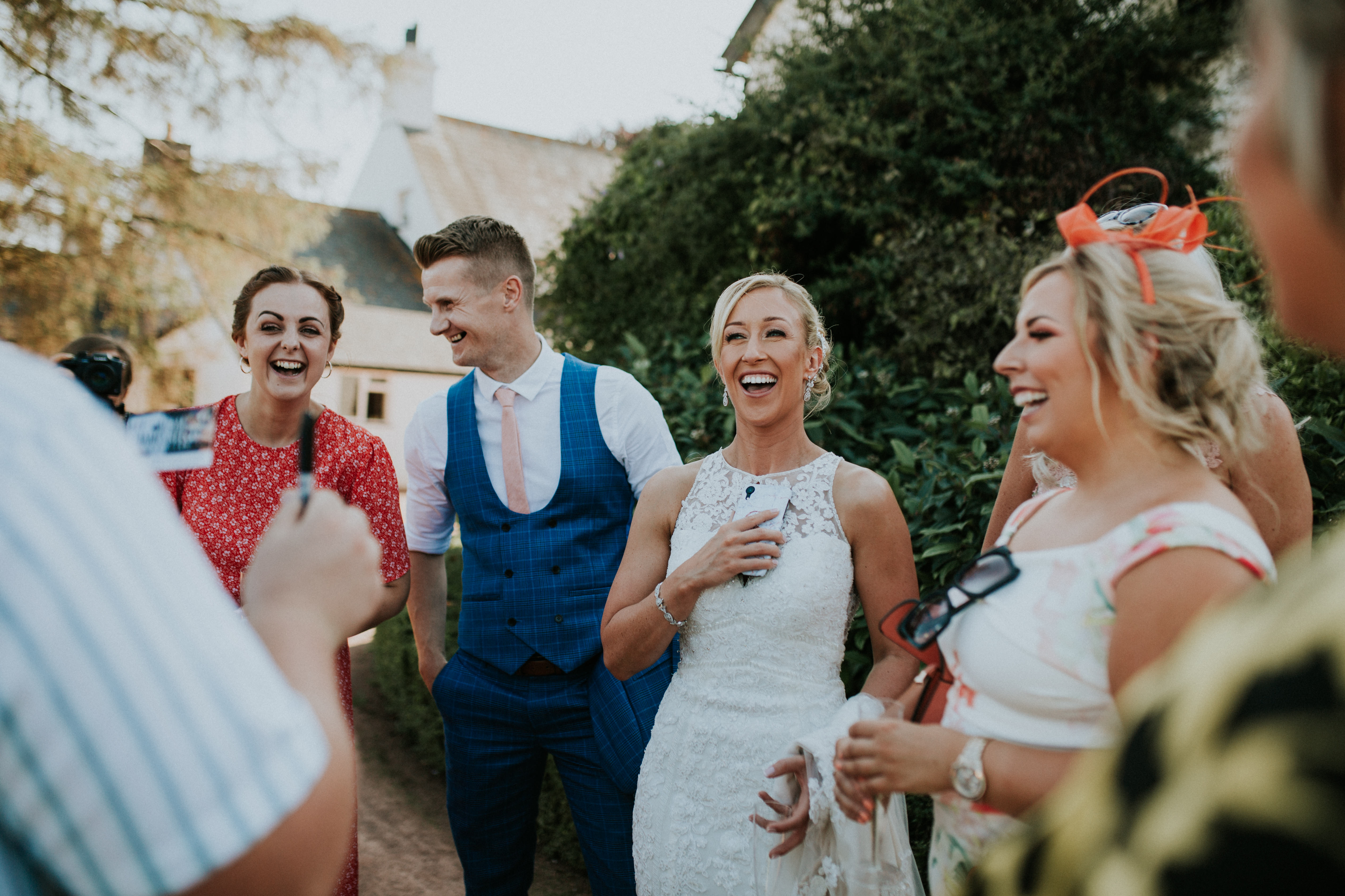 bride laughing at magician 