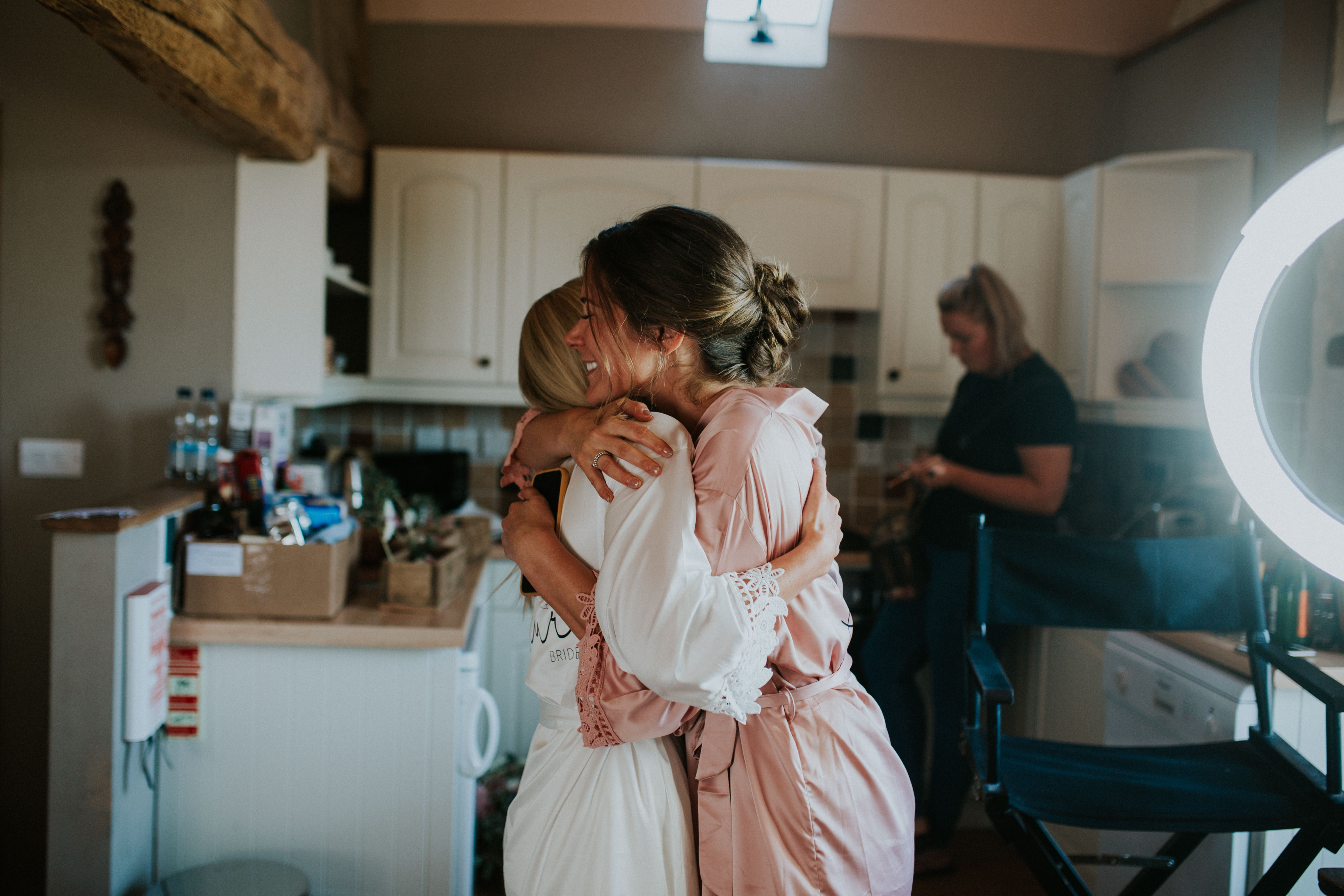 bride and bridesmaids smiling 