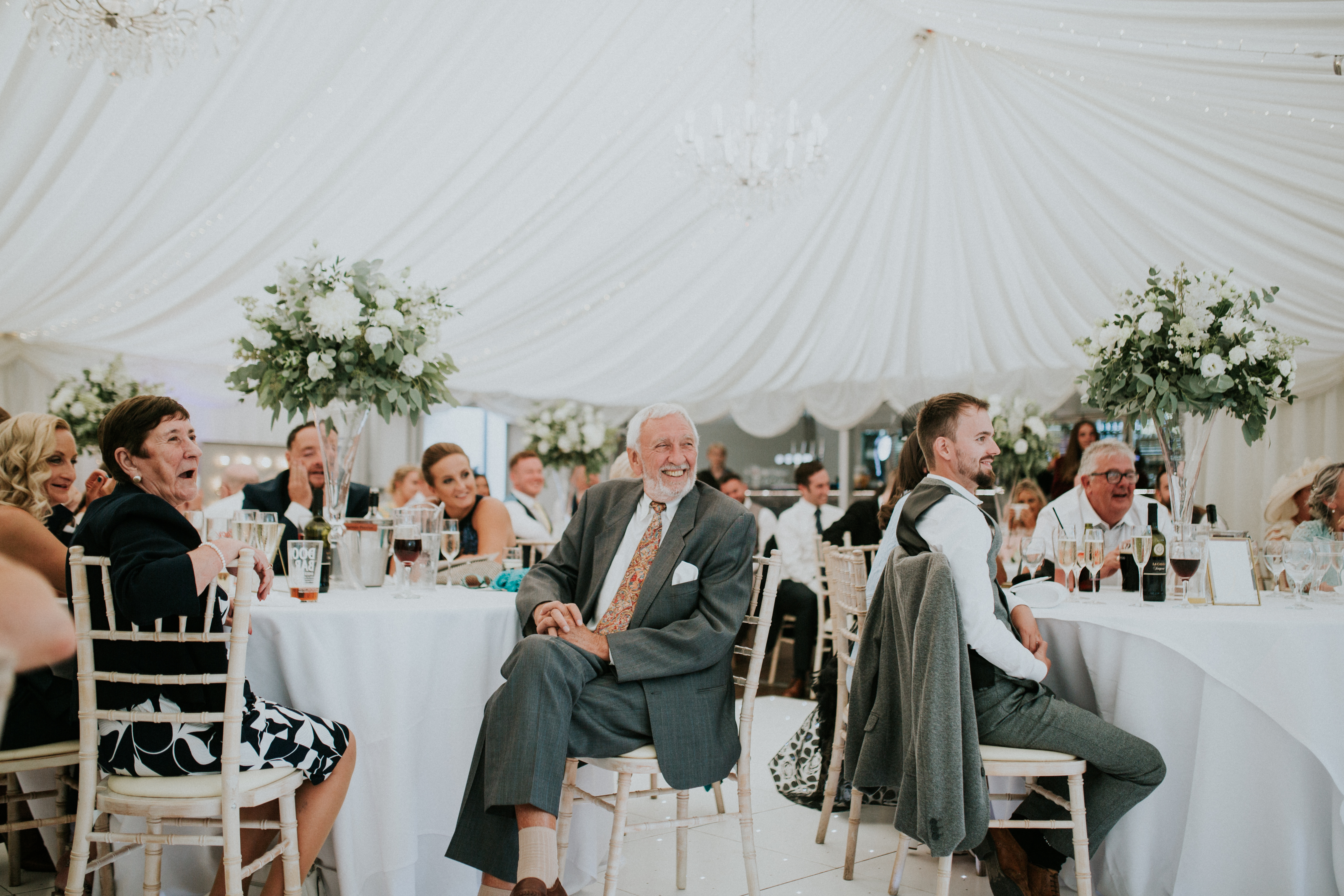 guests laughing at speeches 