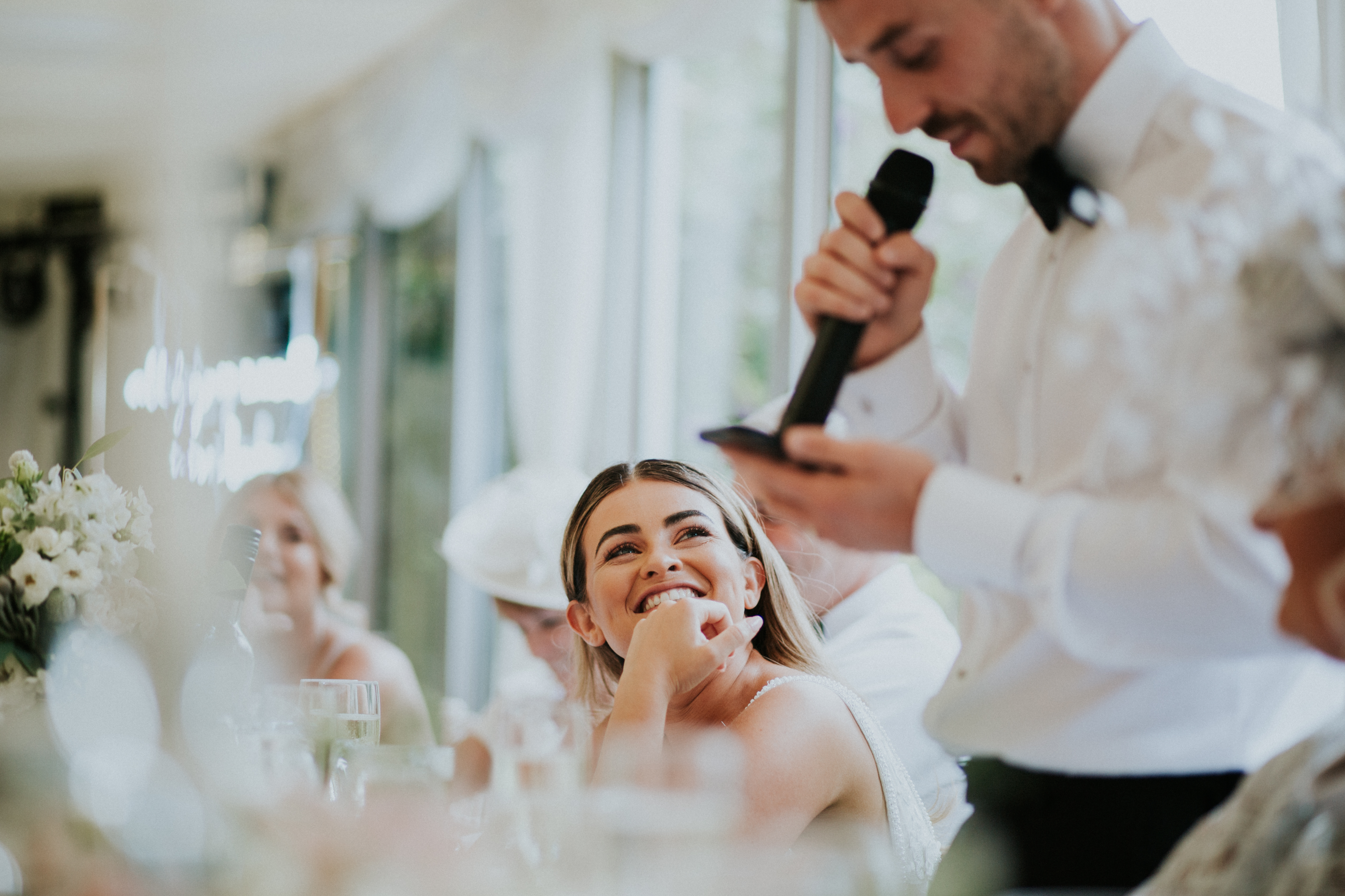 guests laughing at speeches 