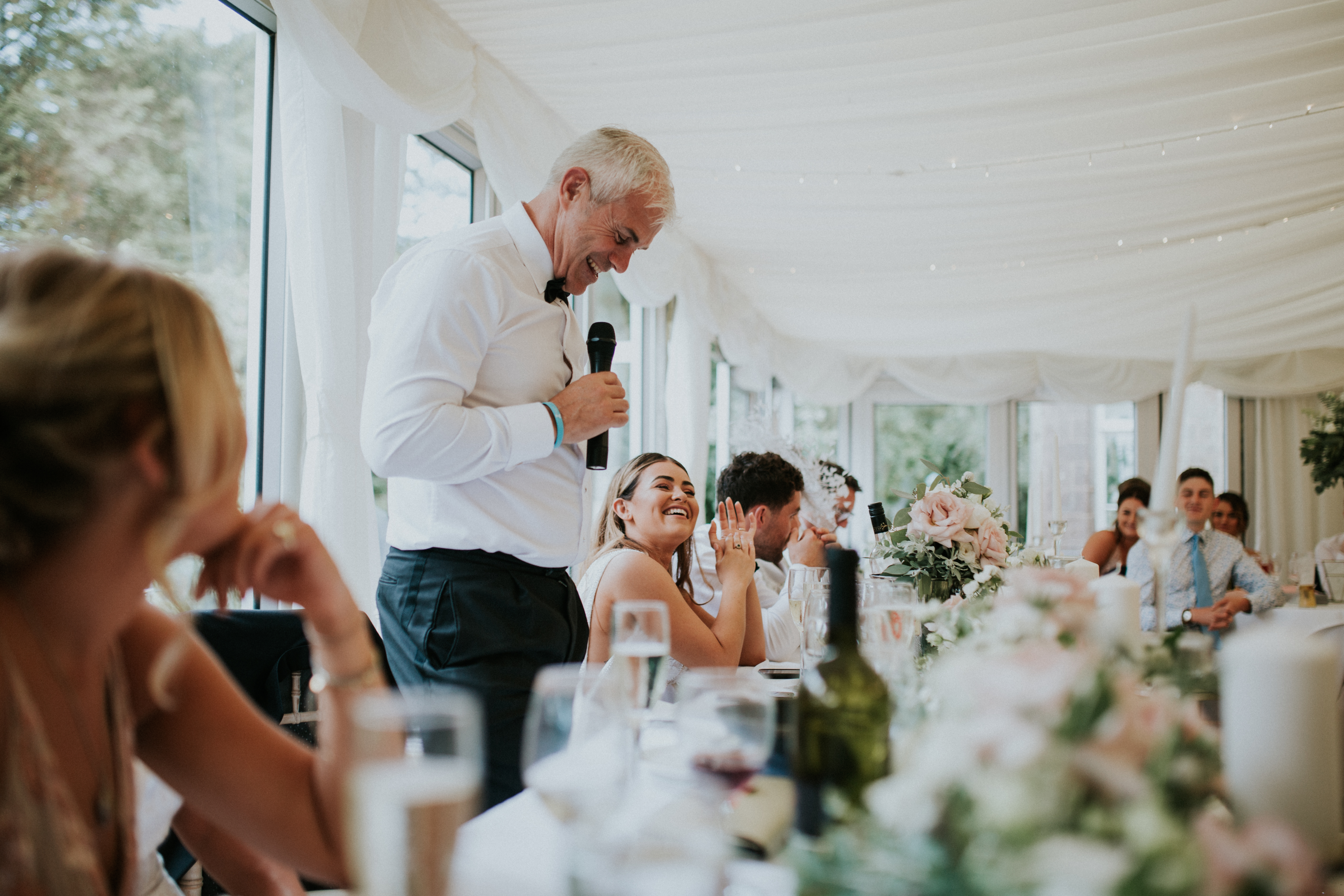 guests laughing at speeches 