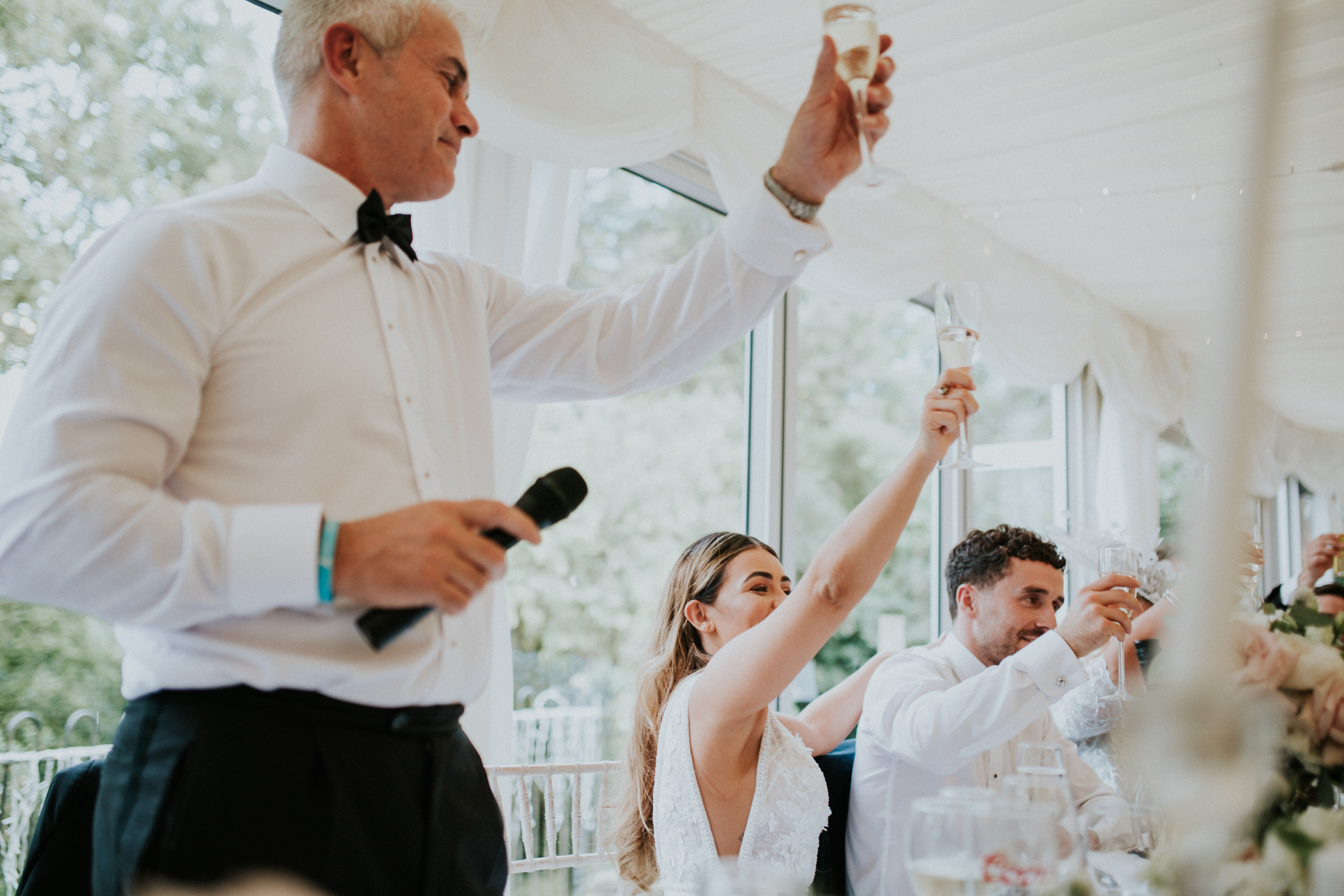 guests laughing at speeches 