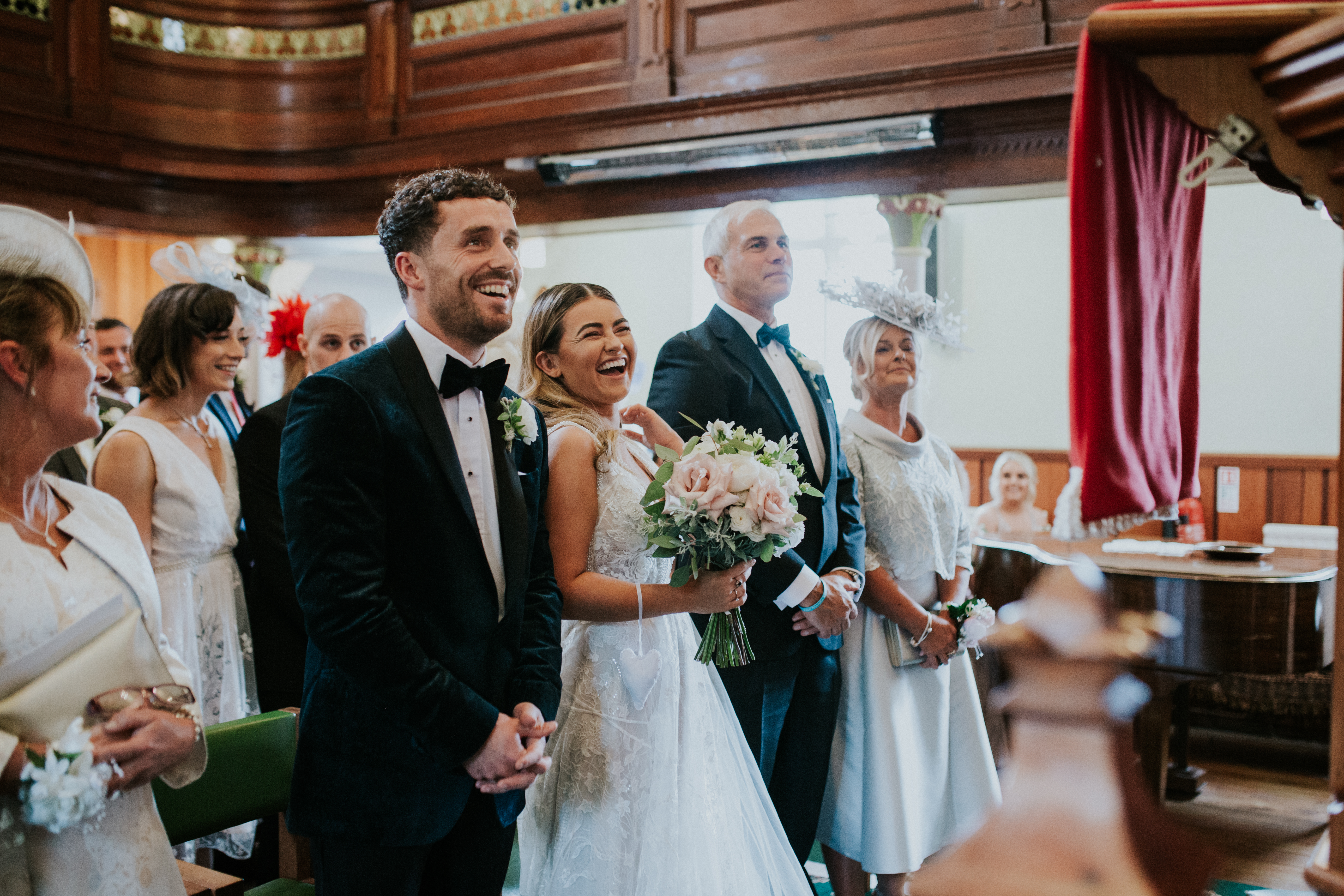 bride and groom smiling in ceremony 