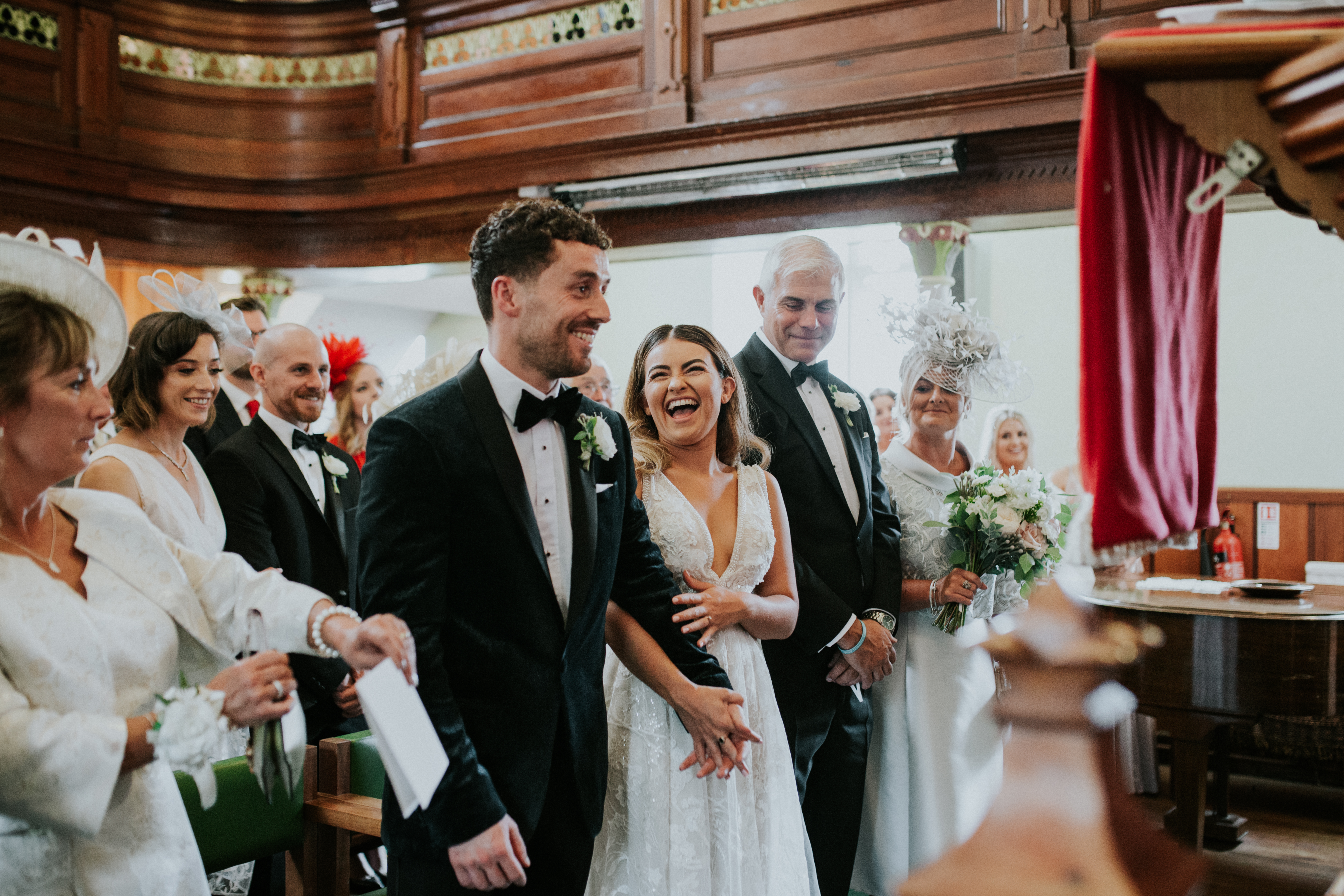 bride and groom laughing 