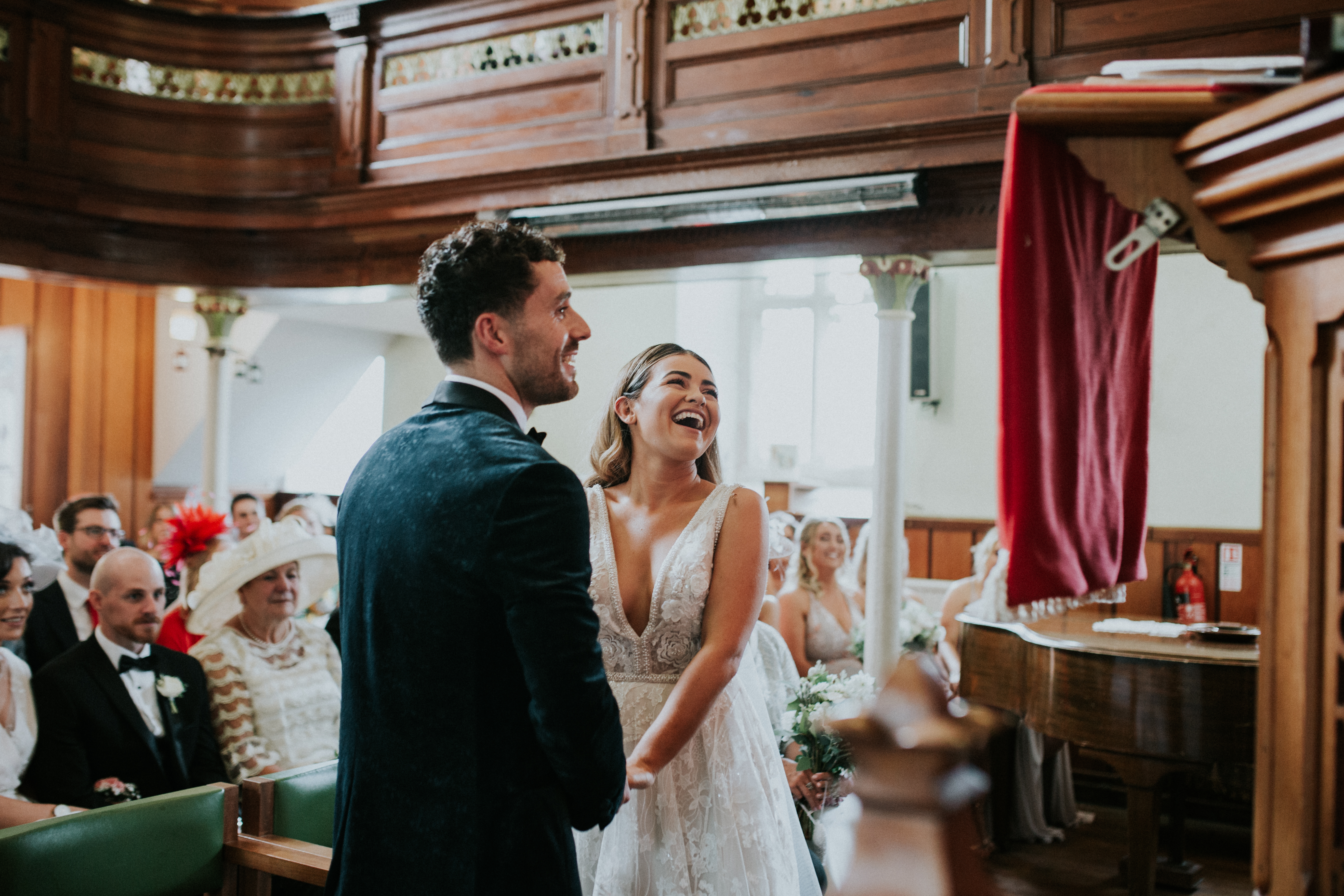 bride and groom laughing 