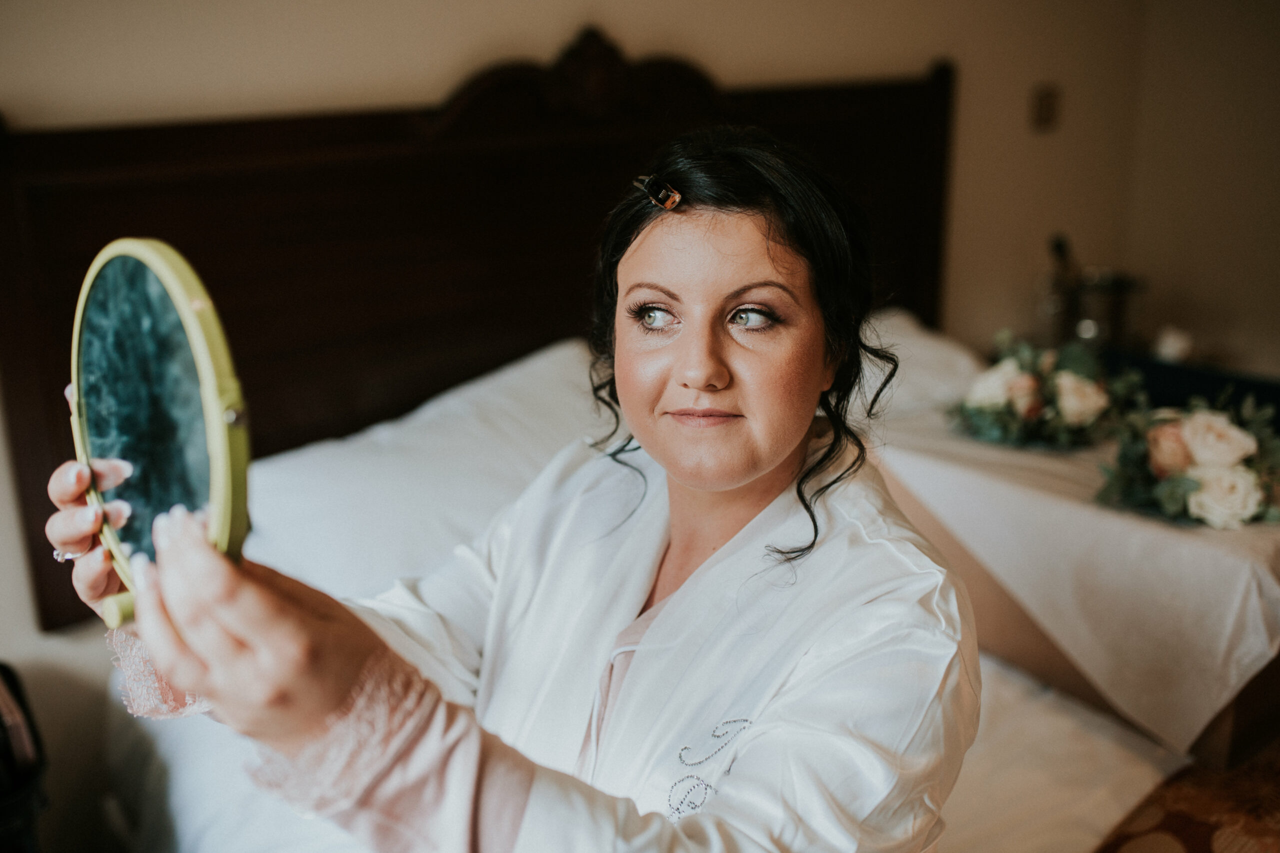 bride looking in the mirror 