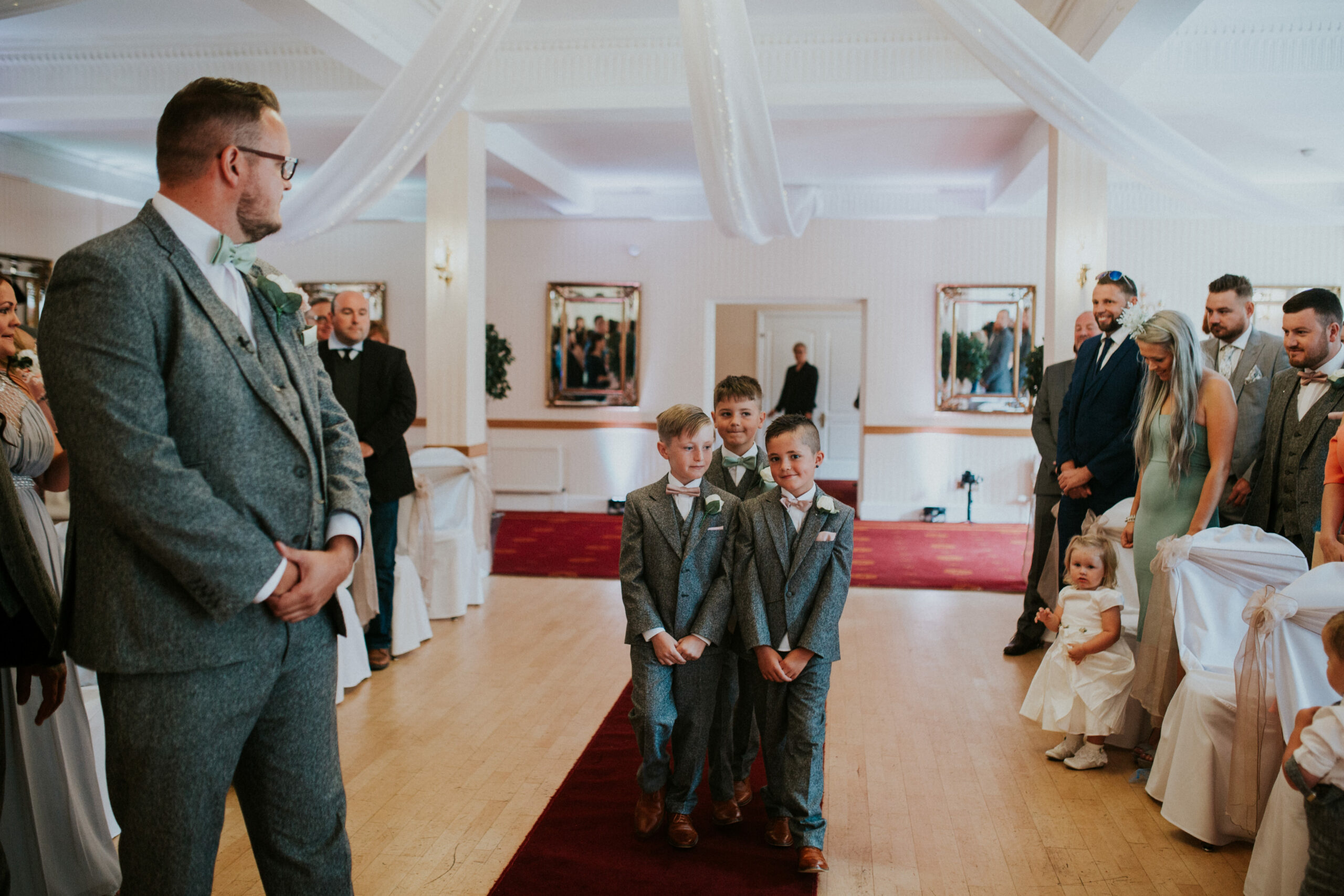 page boys walking down the aisle 