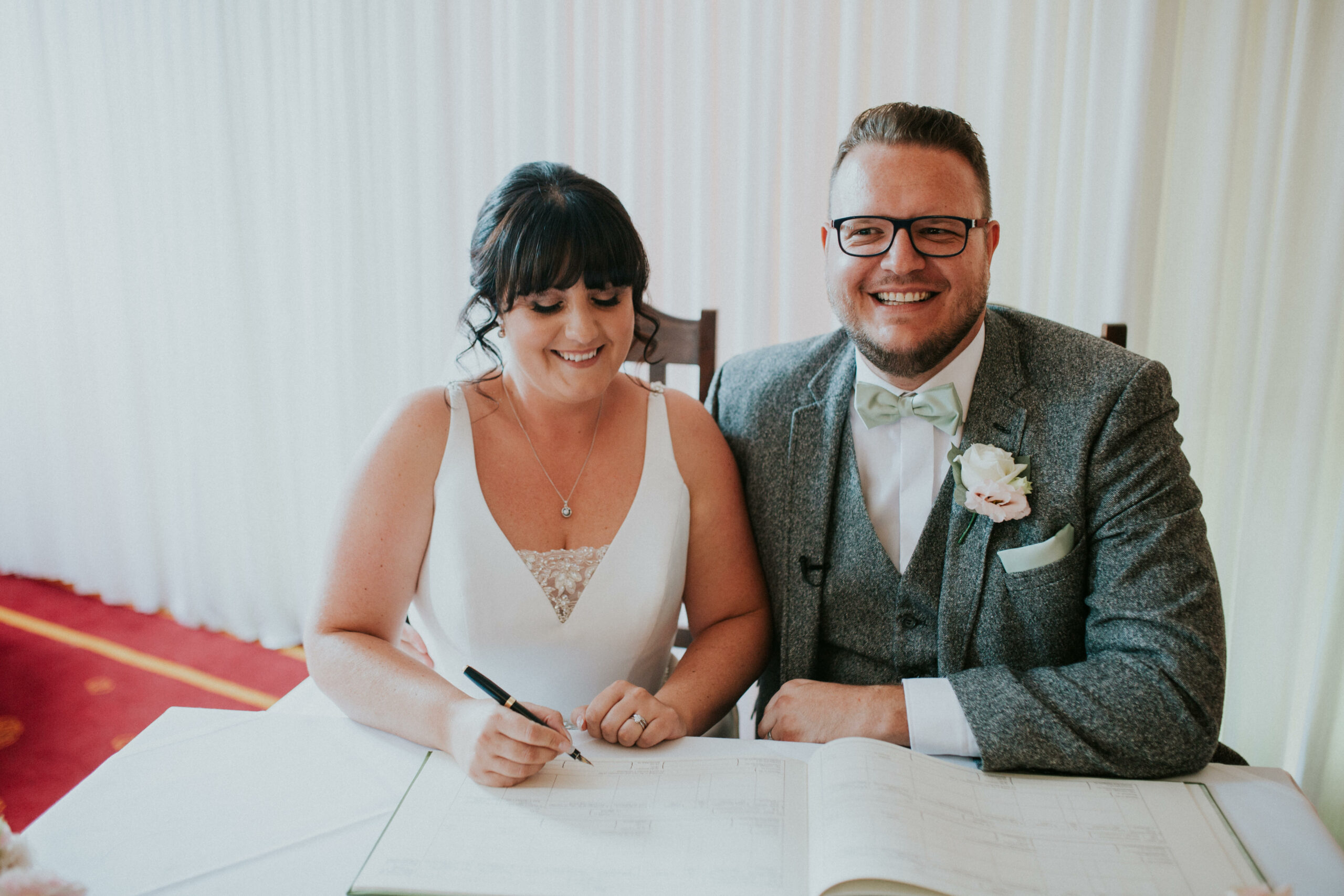 signing the register 