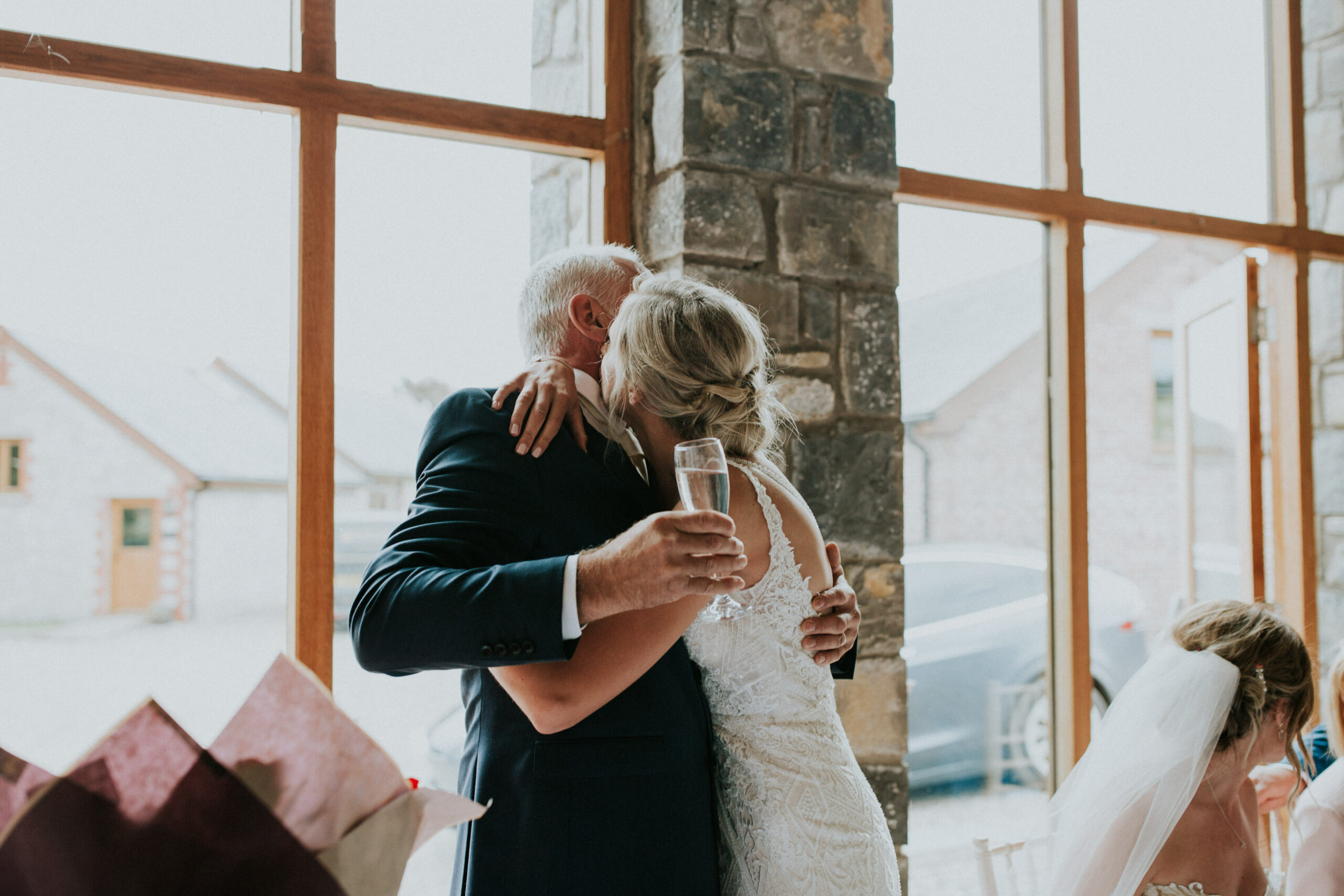 bride and dad hug 