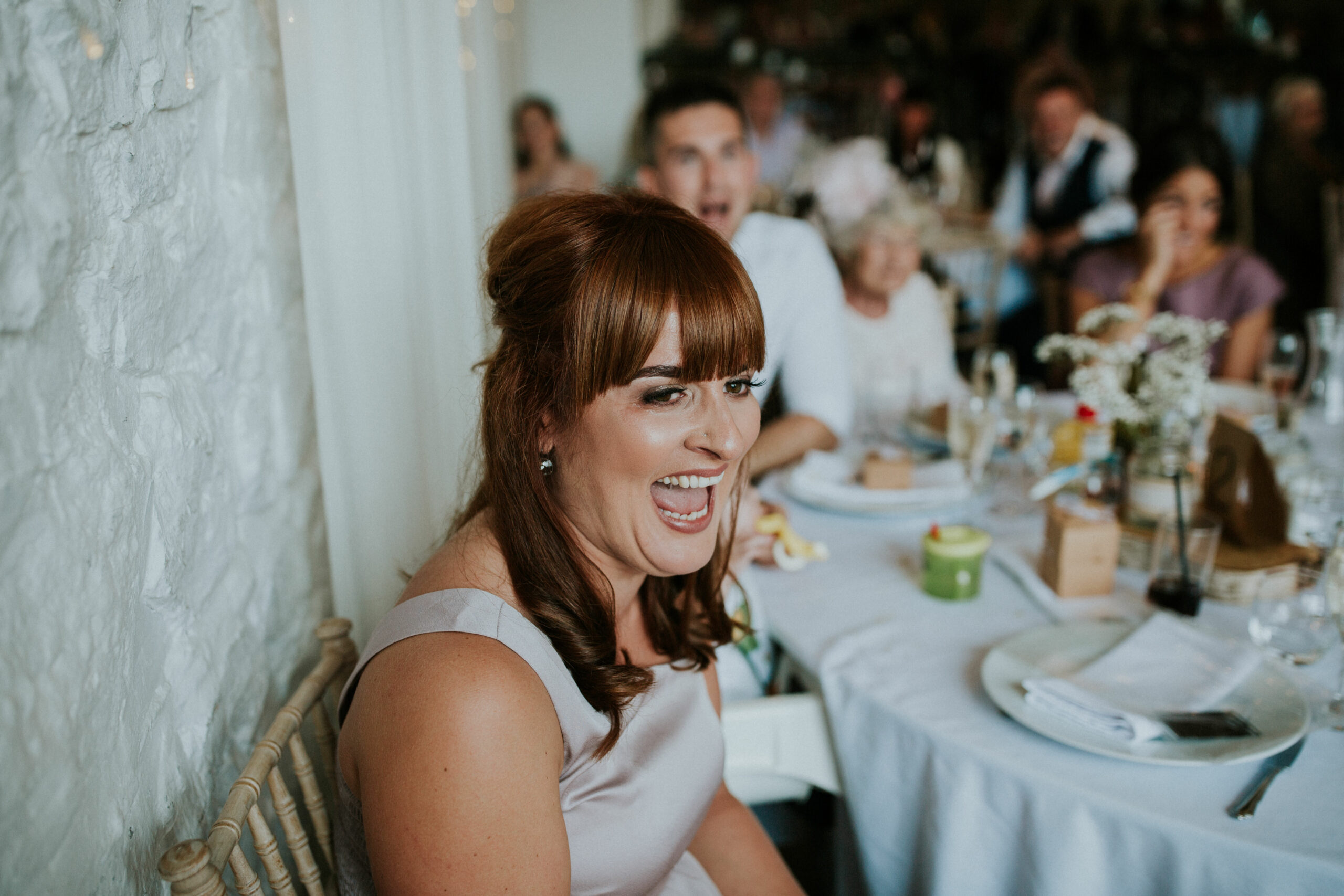 bridesmaids laughing at the speeches 