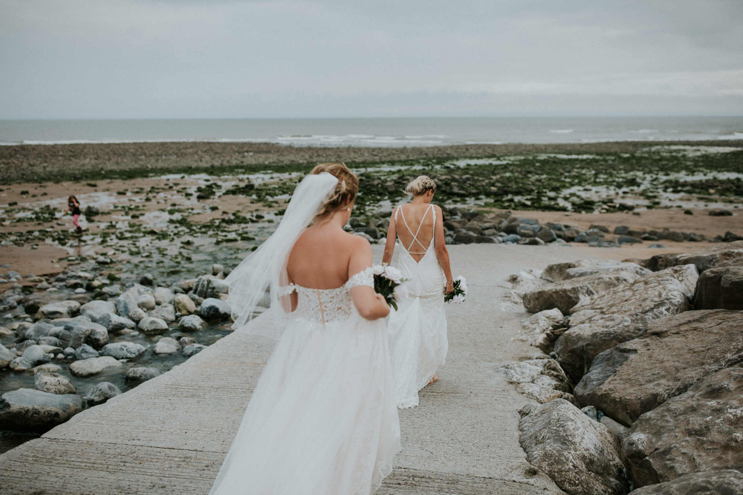 brides portraits down the beach 