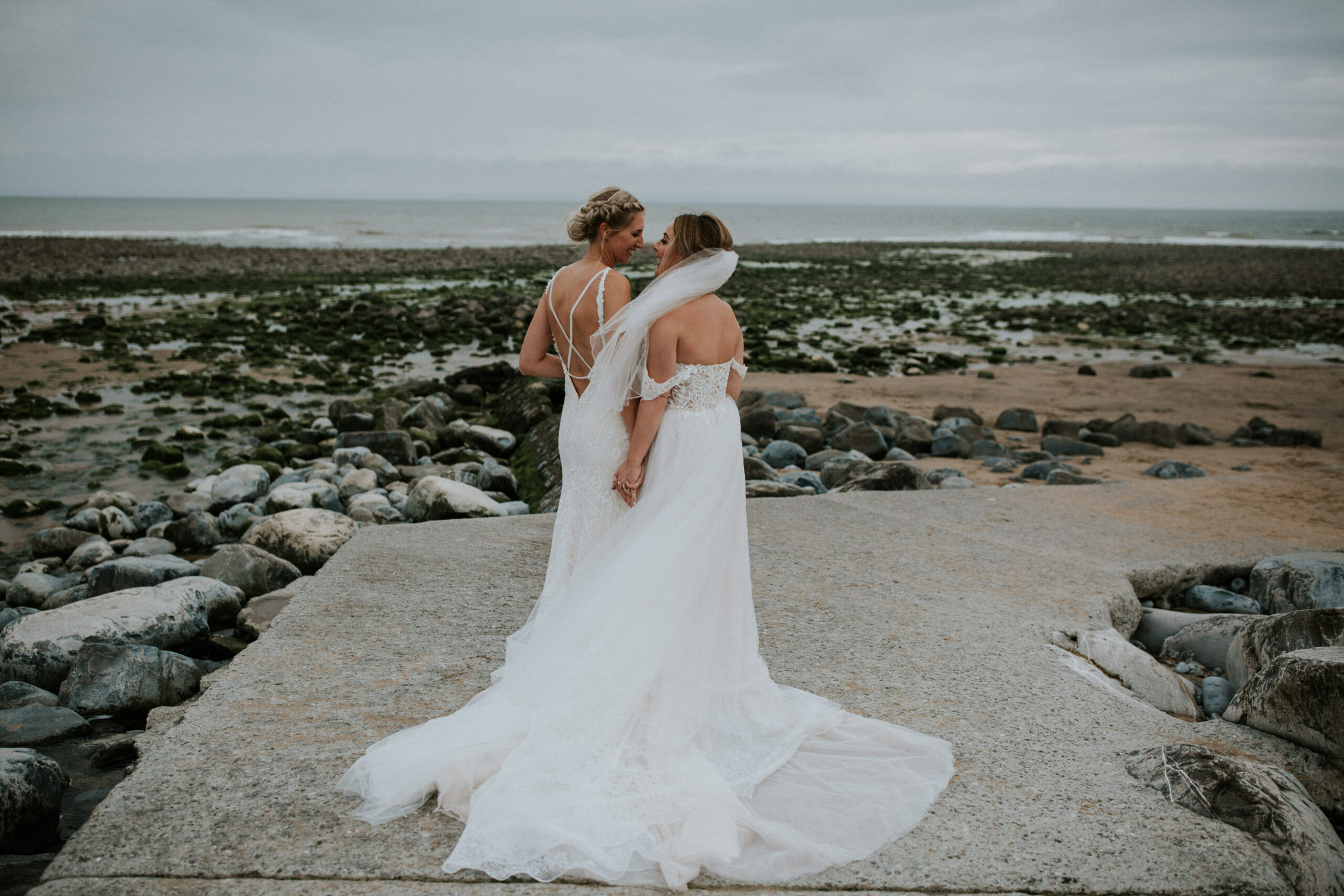 brides portraits down the beach 