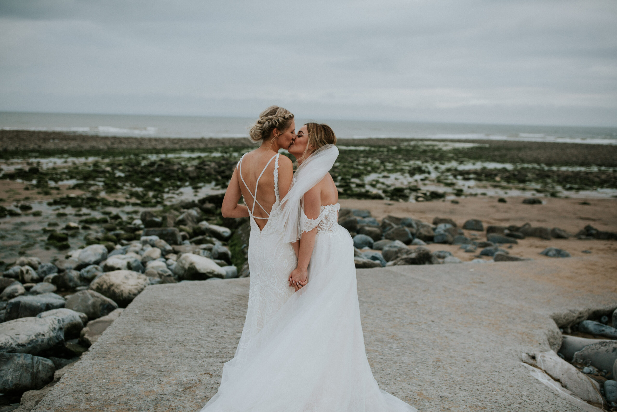 brides portraits down the beach 