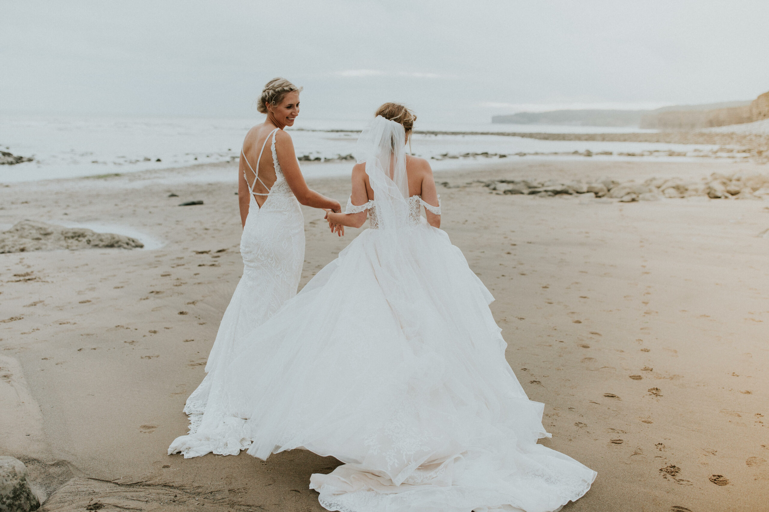 brides portraits down the beach 