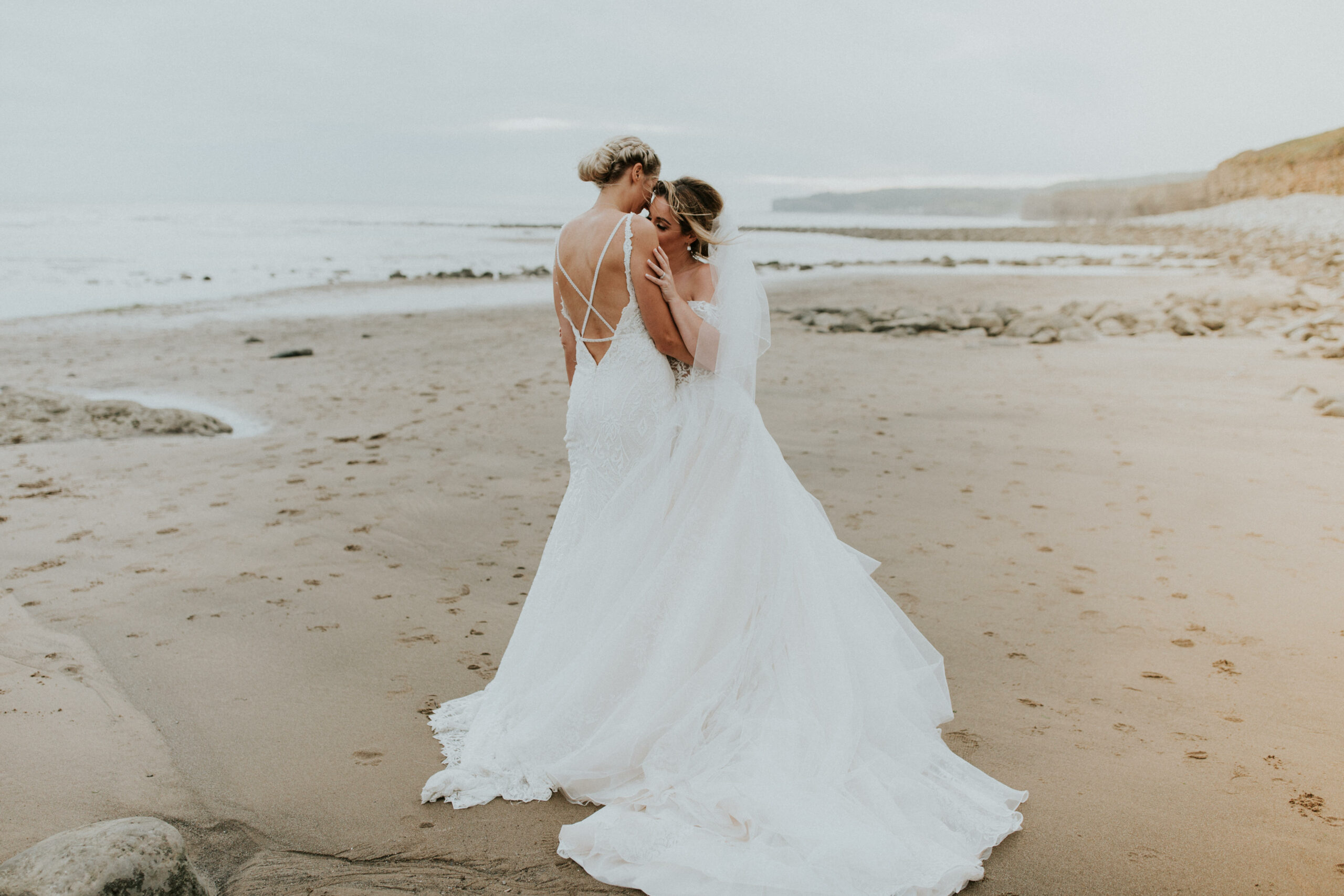 brides portraits down the beach 