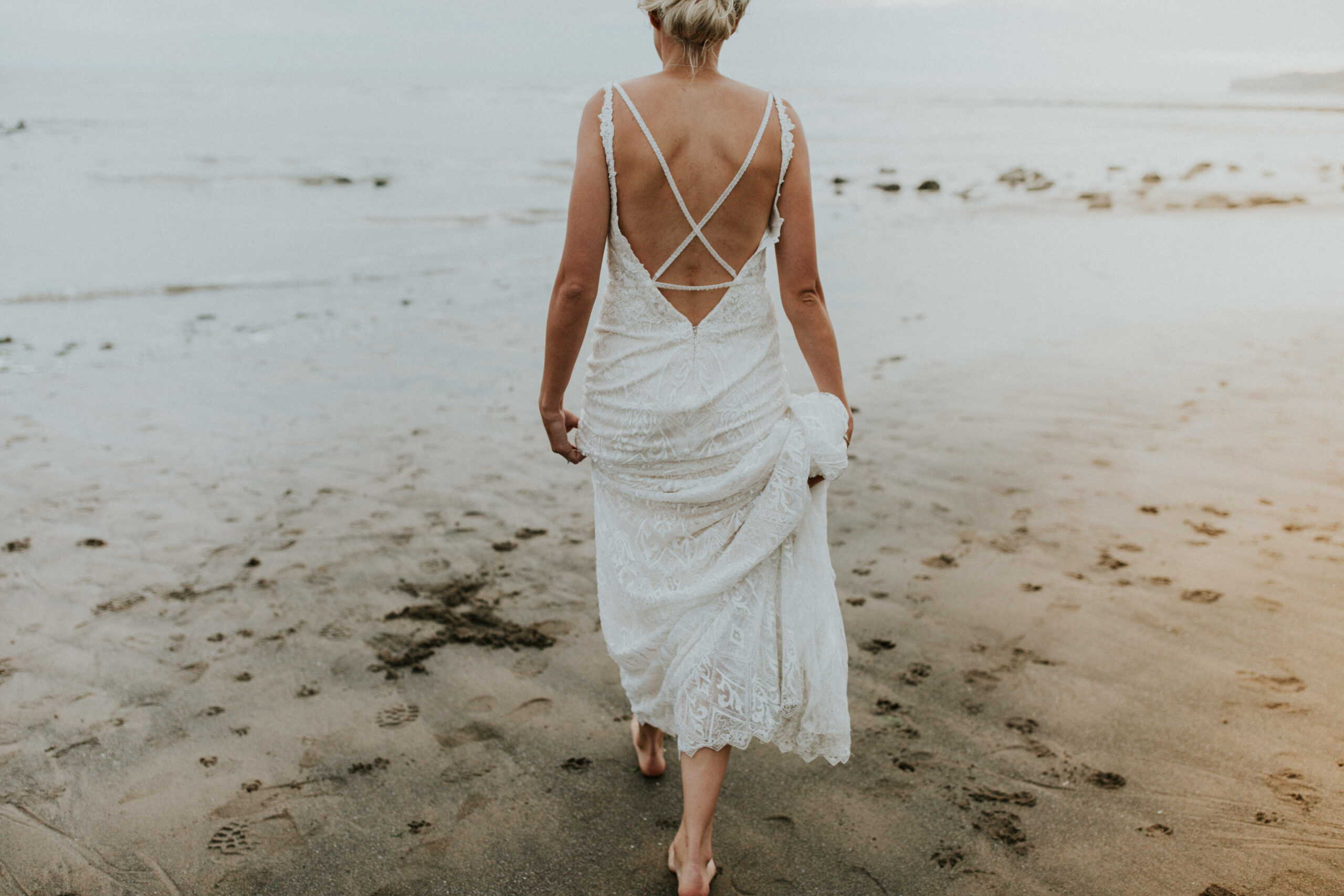 brides portraits down the beach 