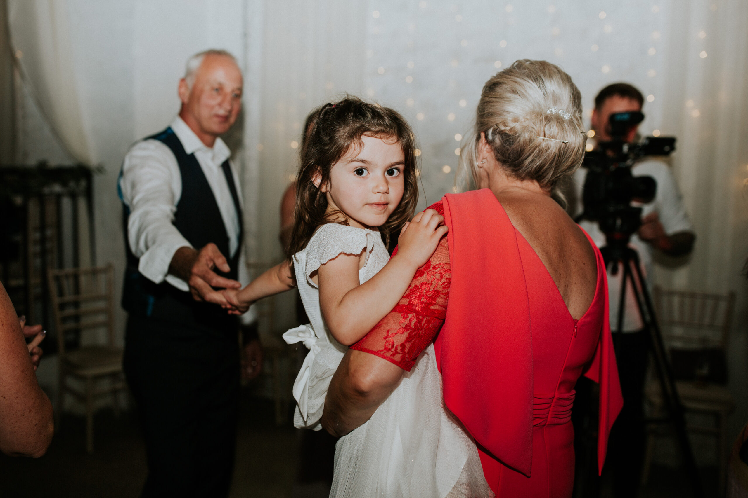 flower girl looking in to the camera 