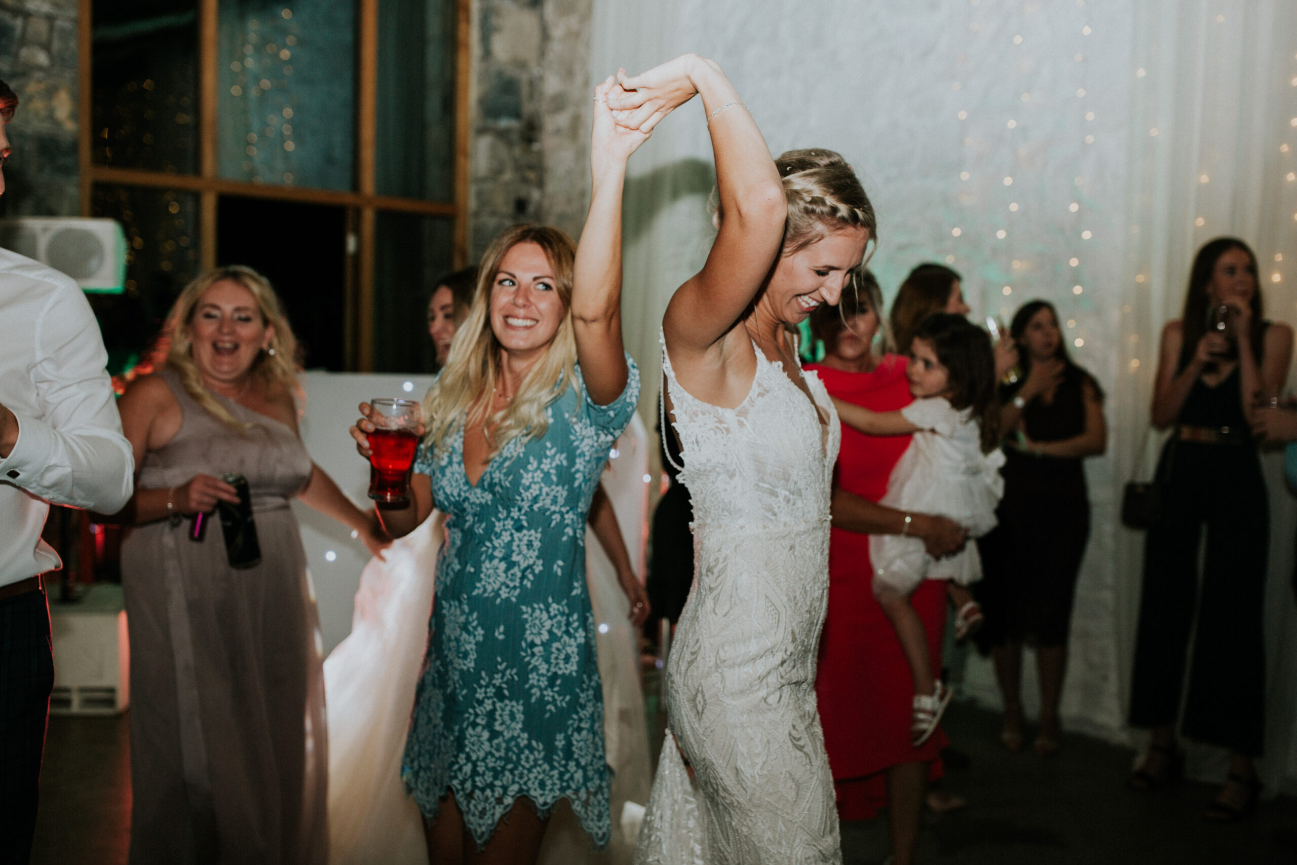 bride and her friend dancing 