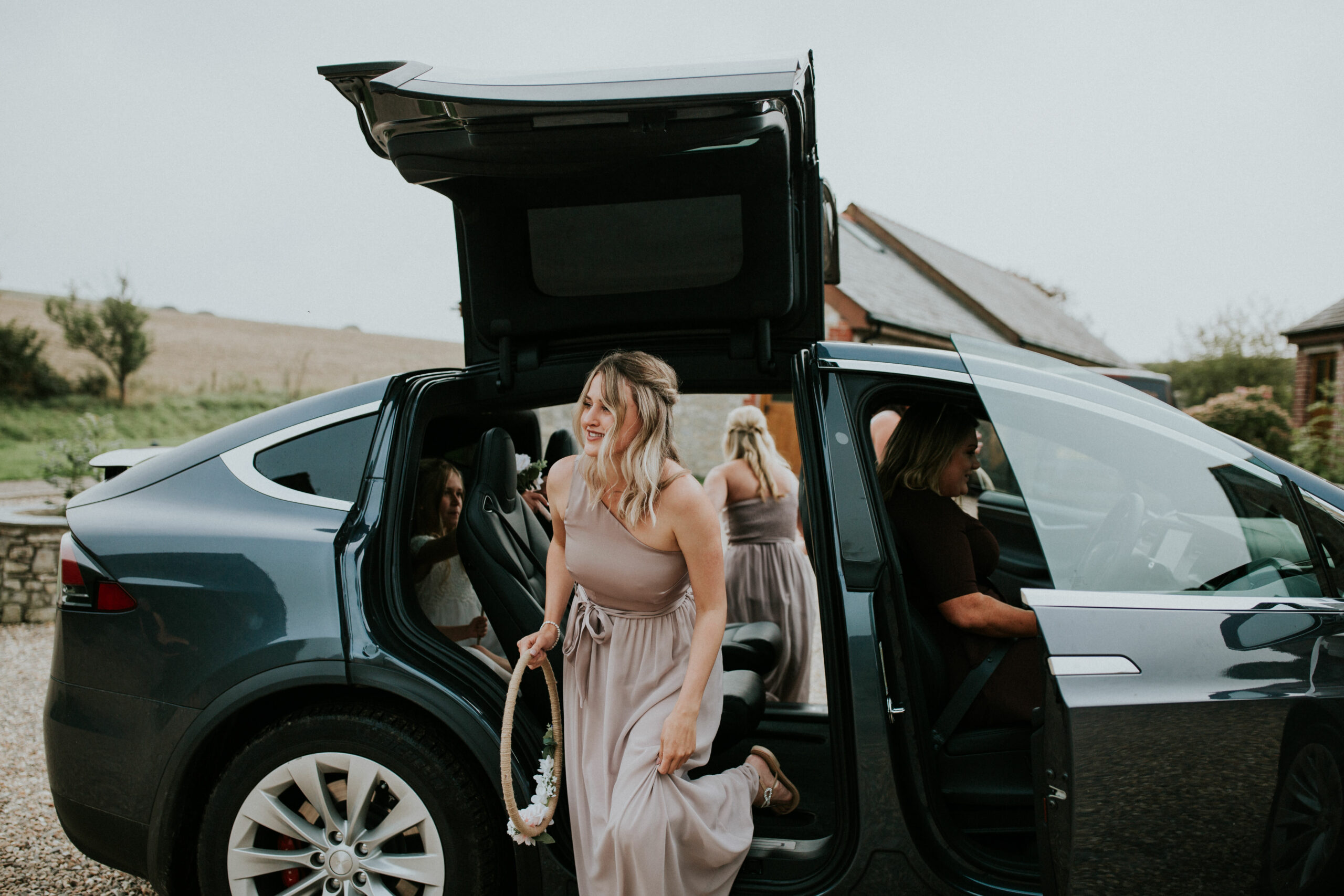 bridesmaids get out of the car
