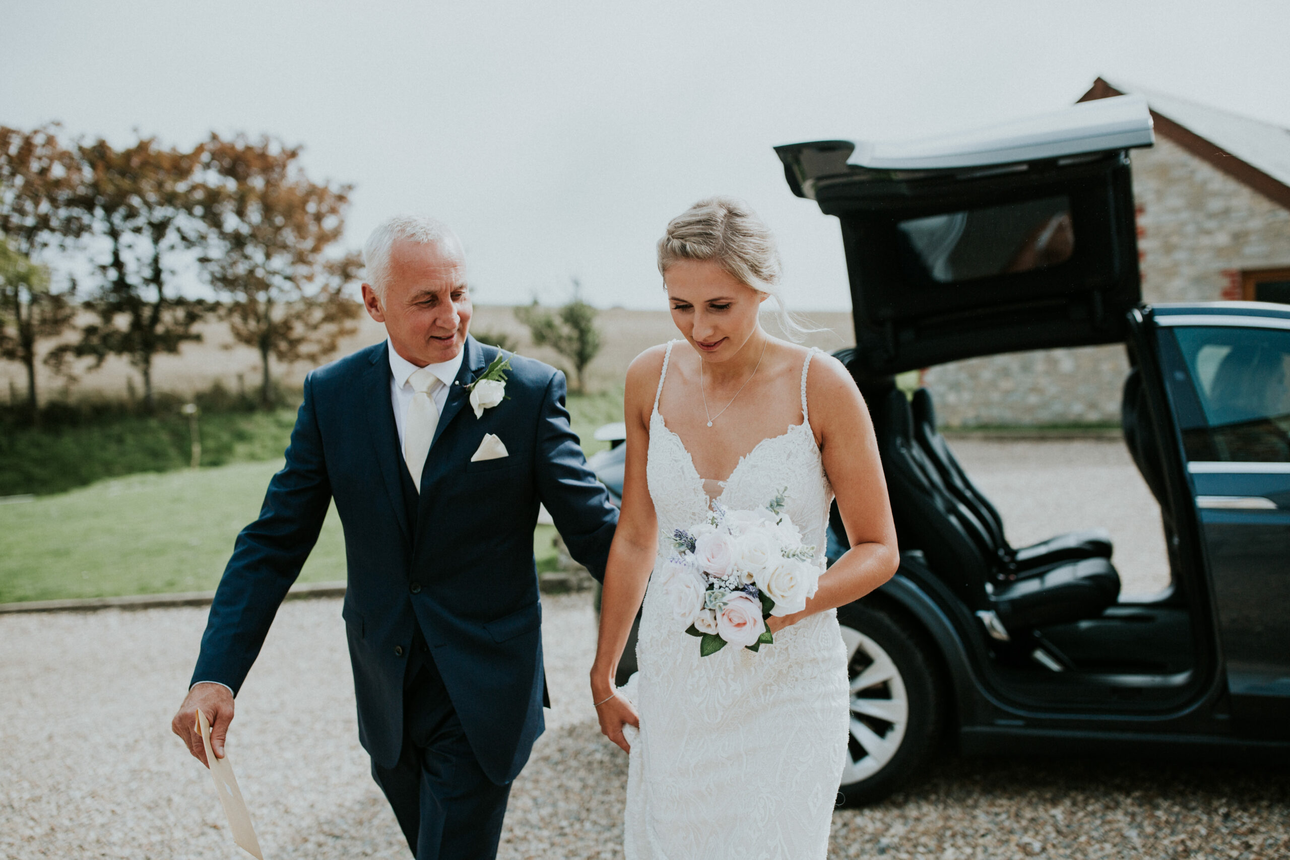 bride and her father walk into the ceremony