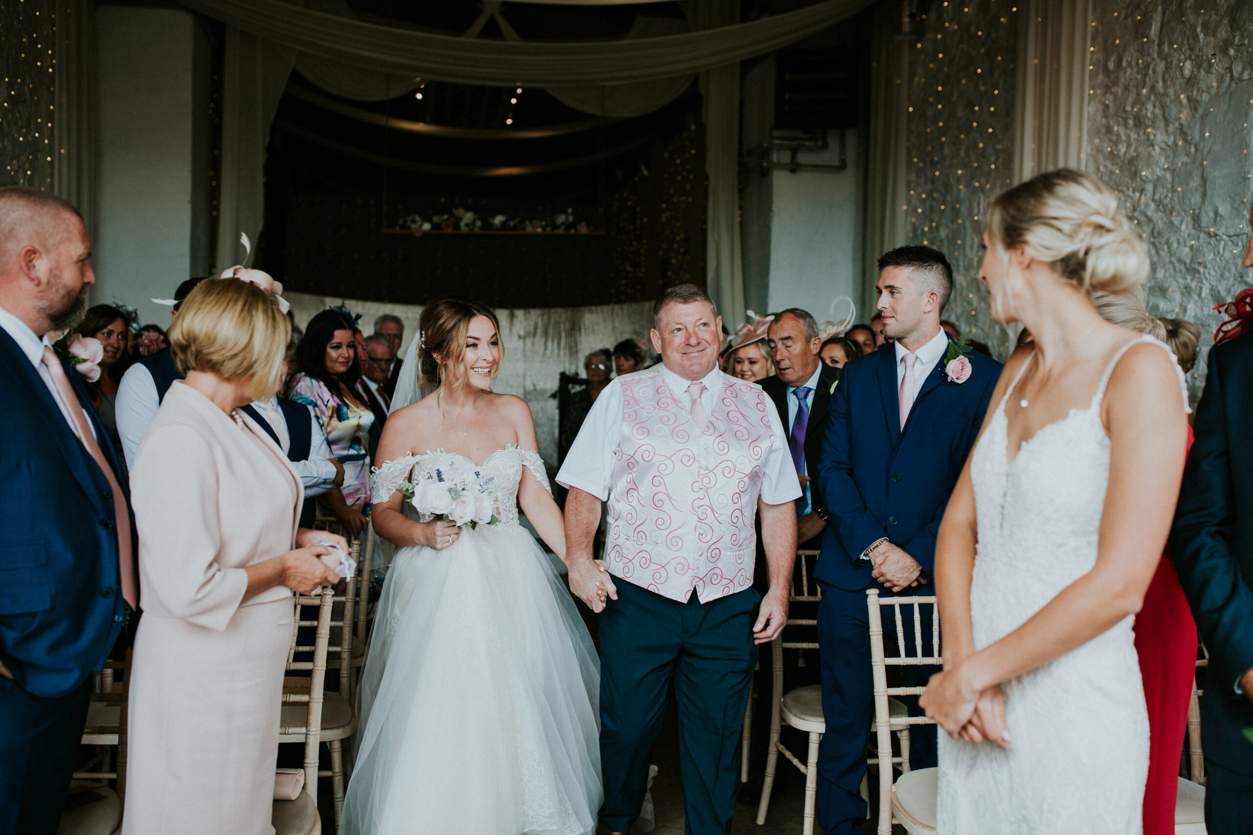 brides smiling at eachother