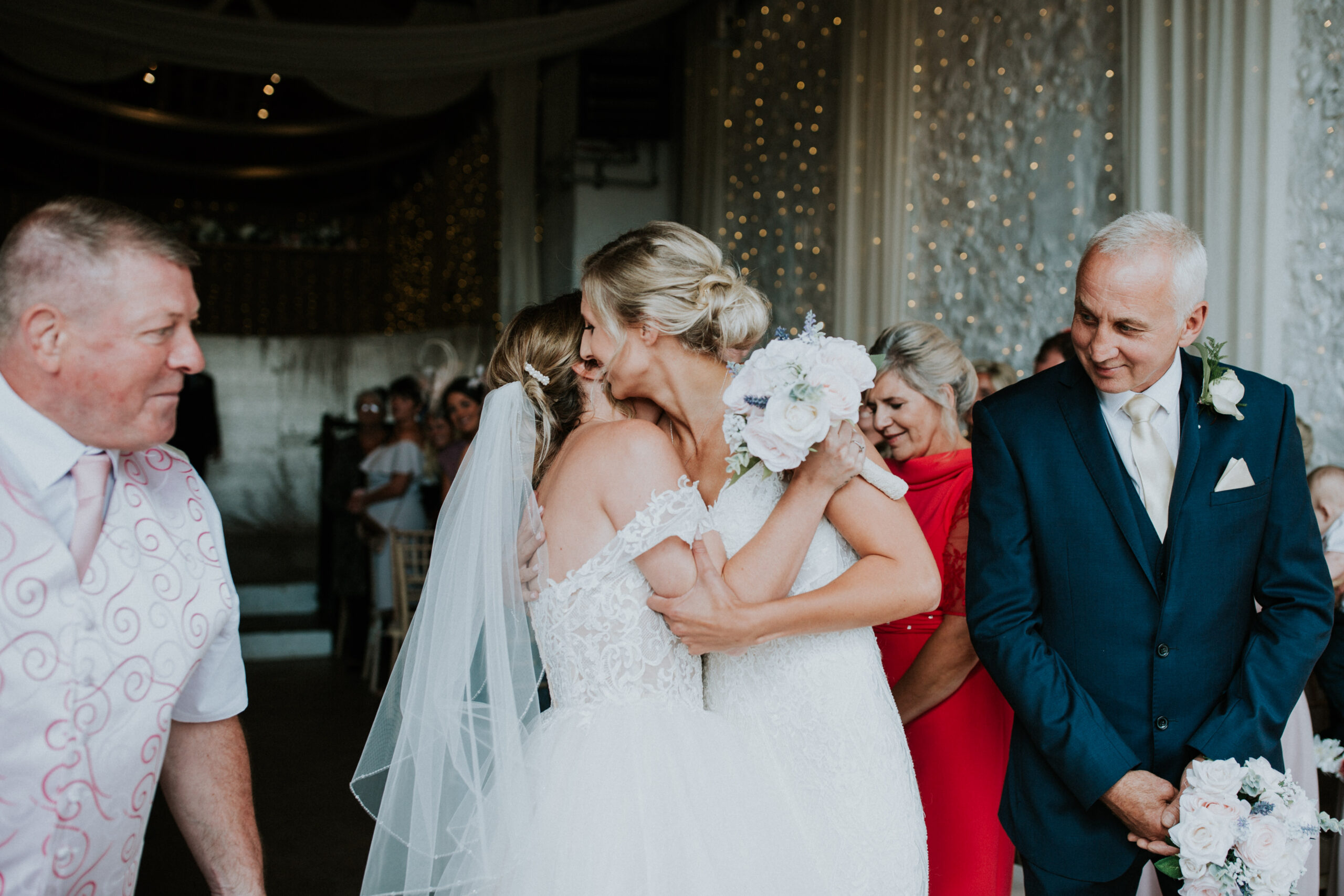 brides hugging