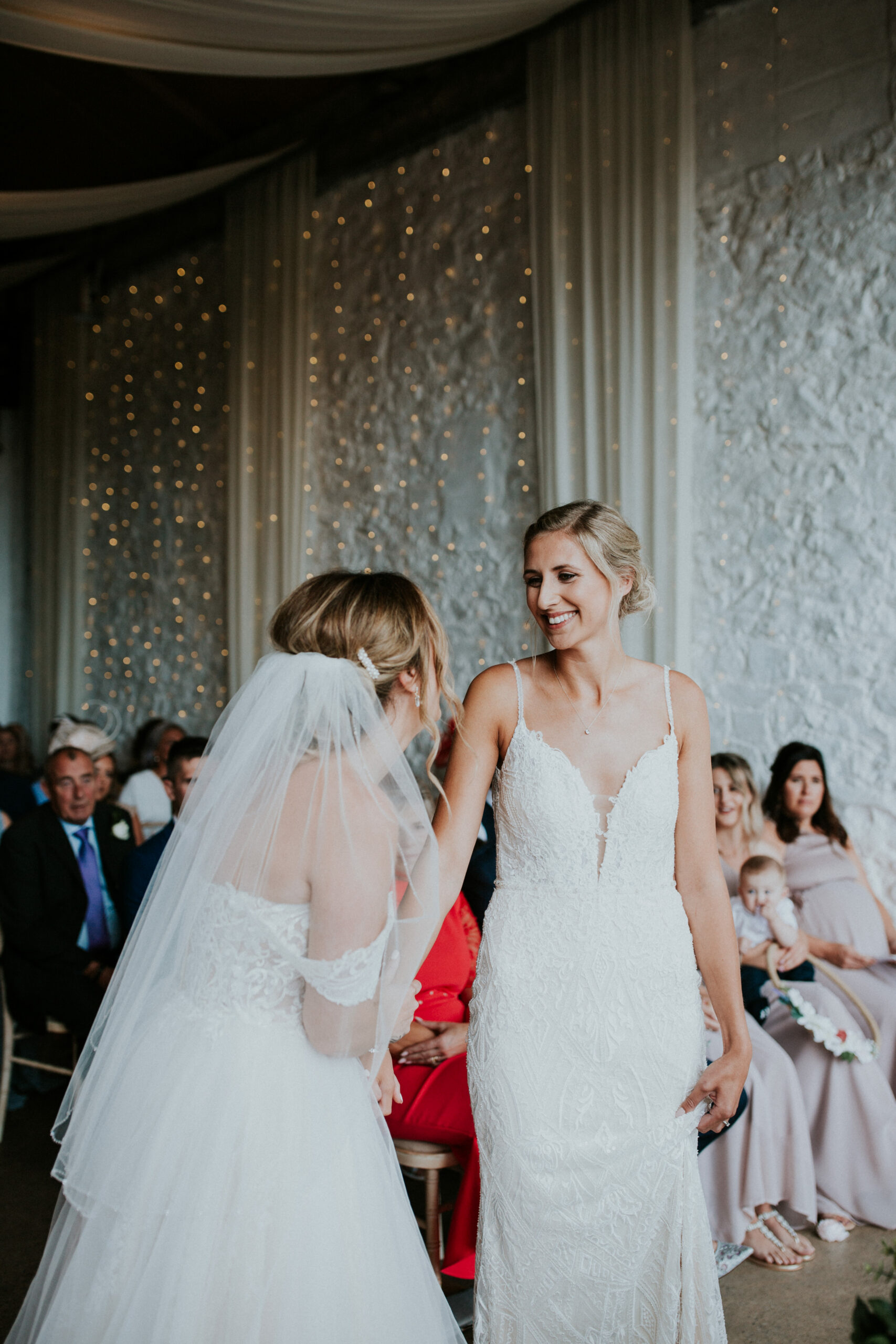 brides smiling in the ceremony