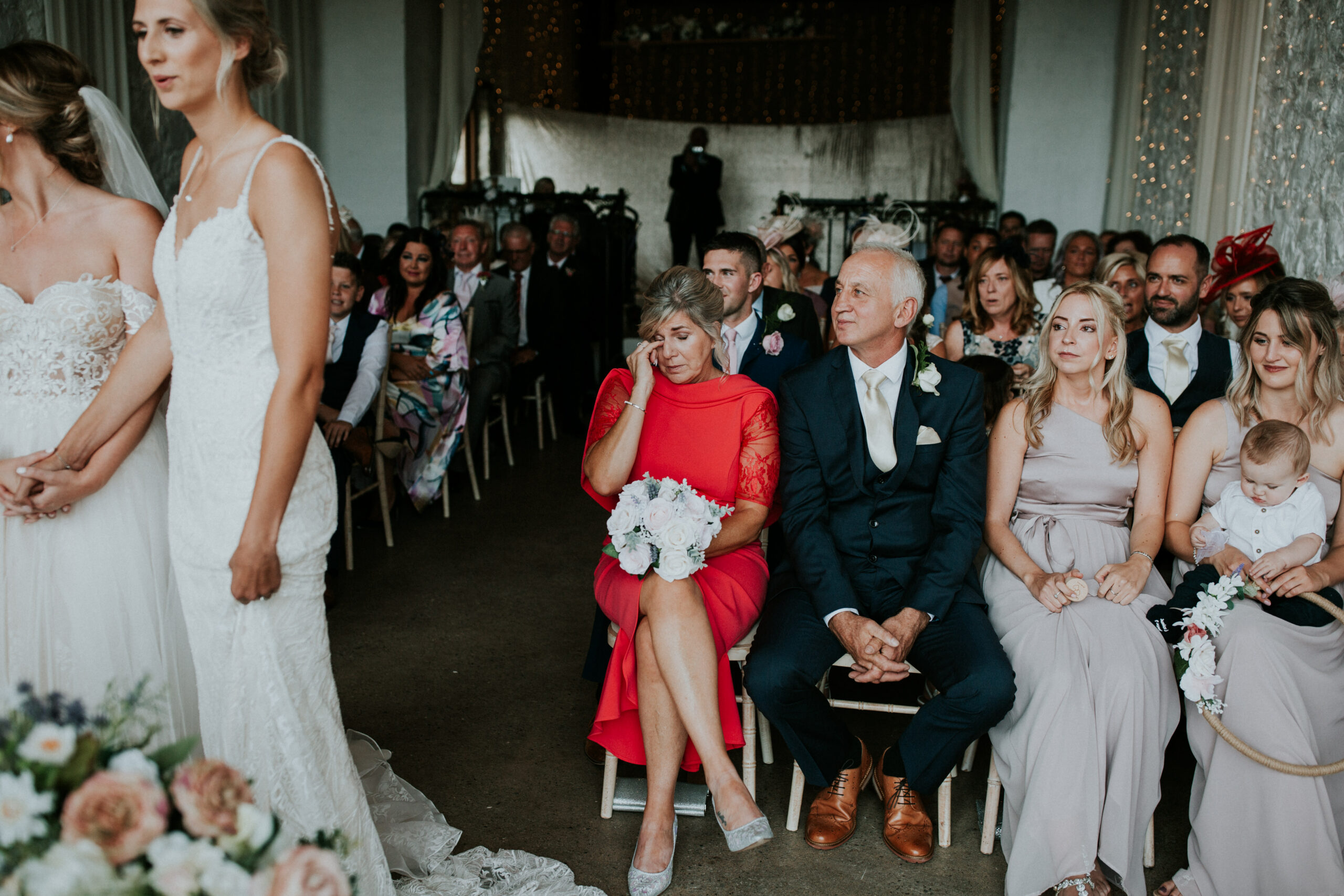 mother of the bride crying  in the ceremony 