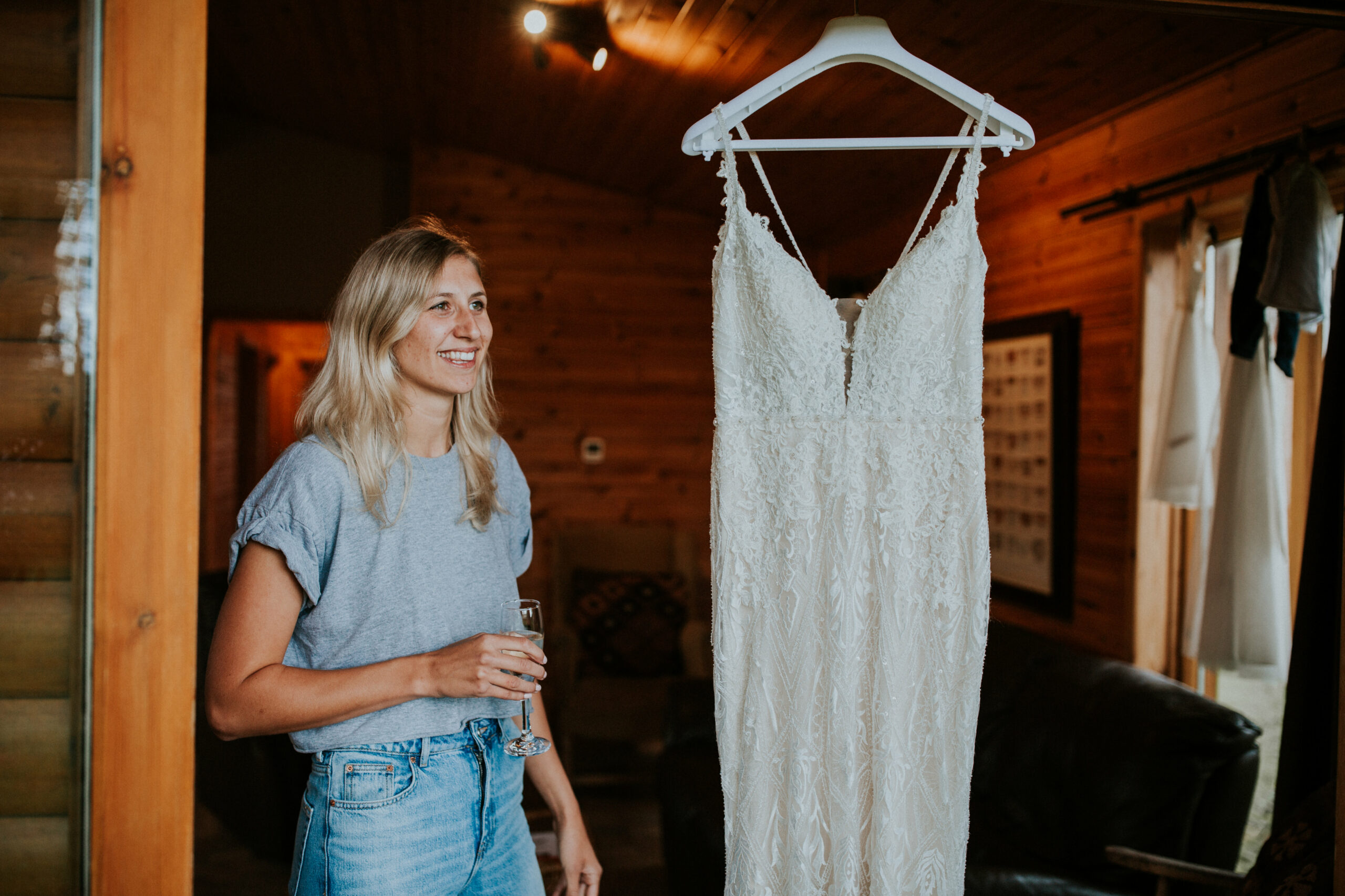 bride looking at her dress 